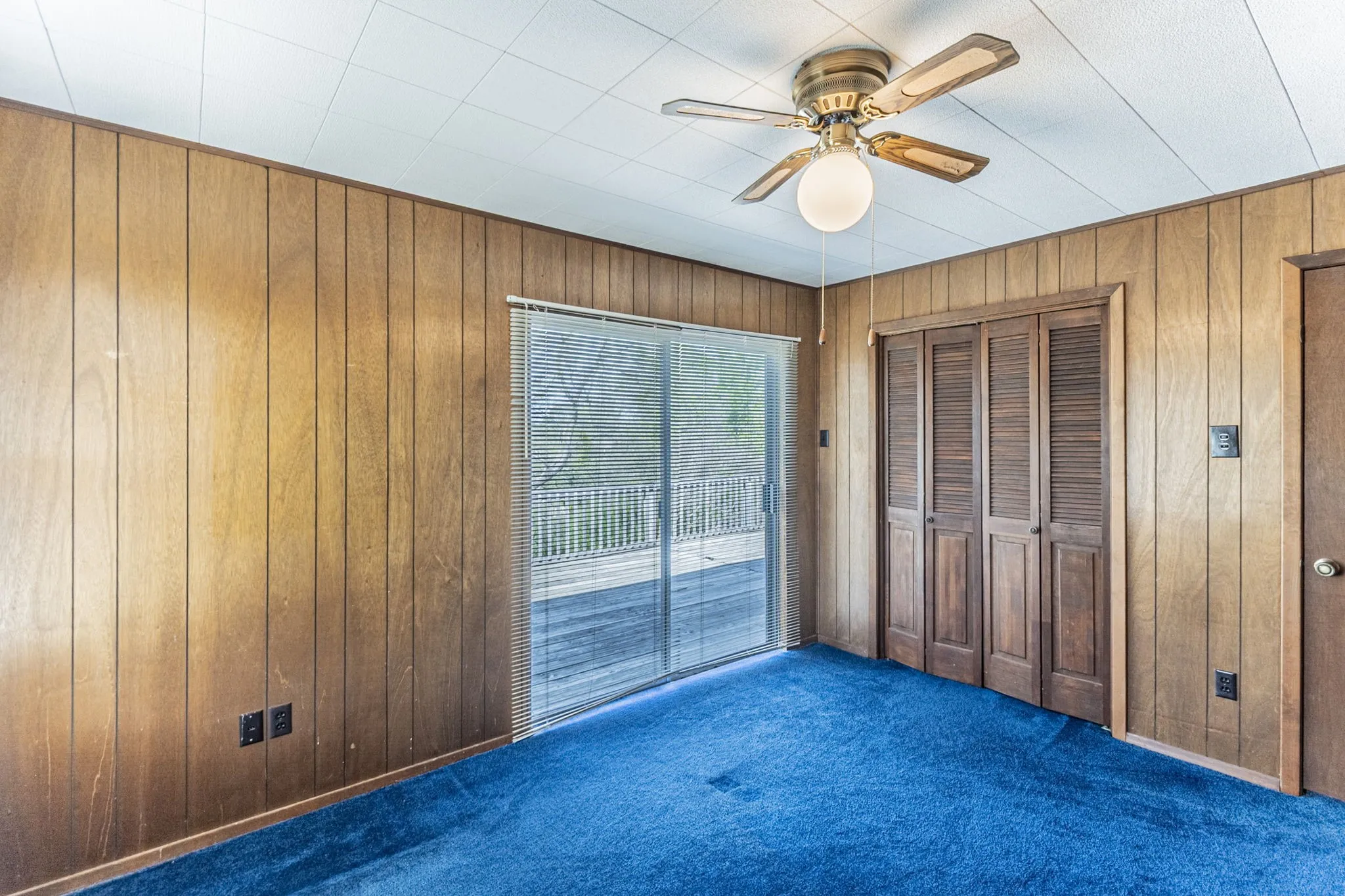 The primary bedroom includes a double closet and ceiling fan.
