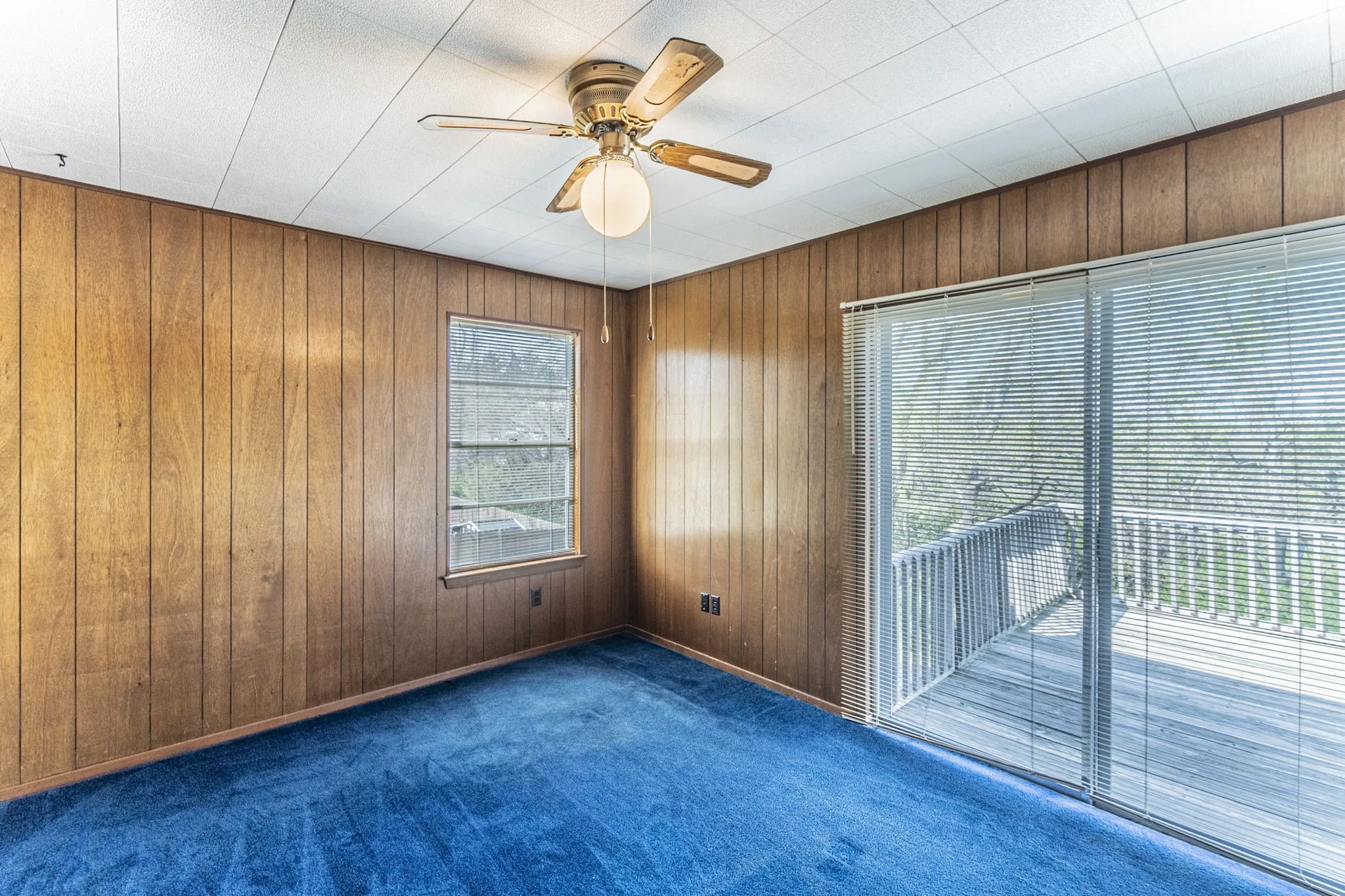 The primary bedroom includes a private exit to the deck.