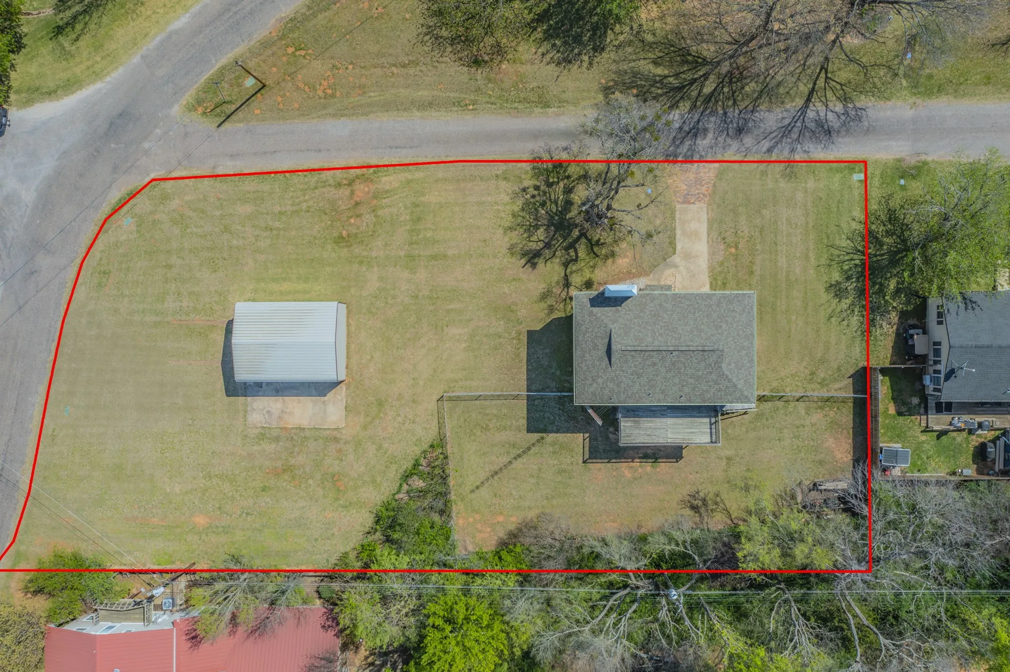 This photo shows both parcels - one with the house and one with the storage barn and extra parking pad for your boat and RV!