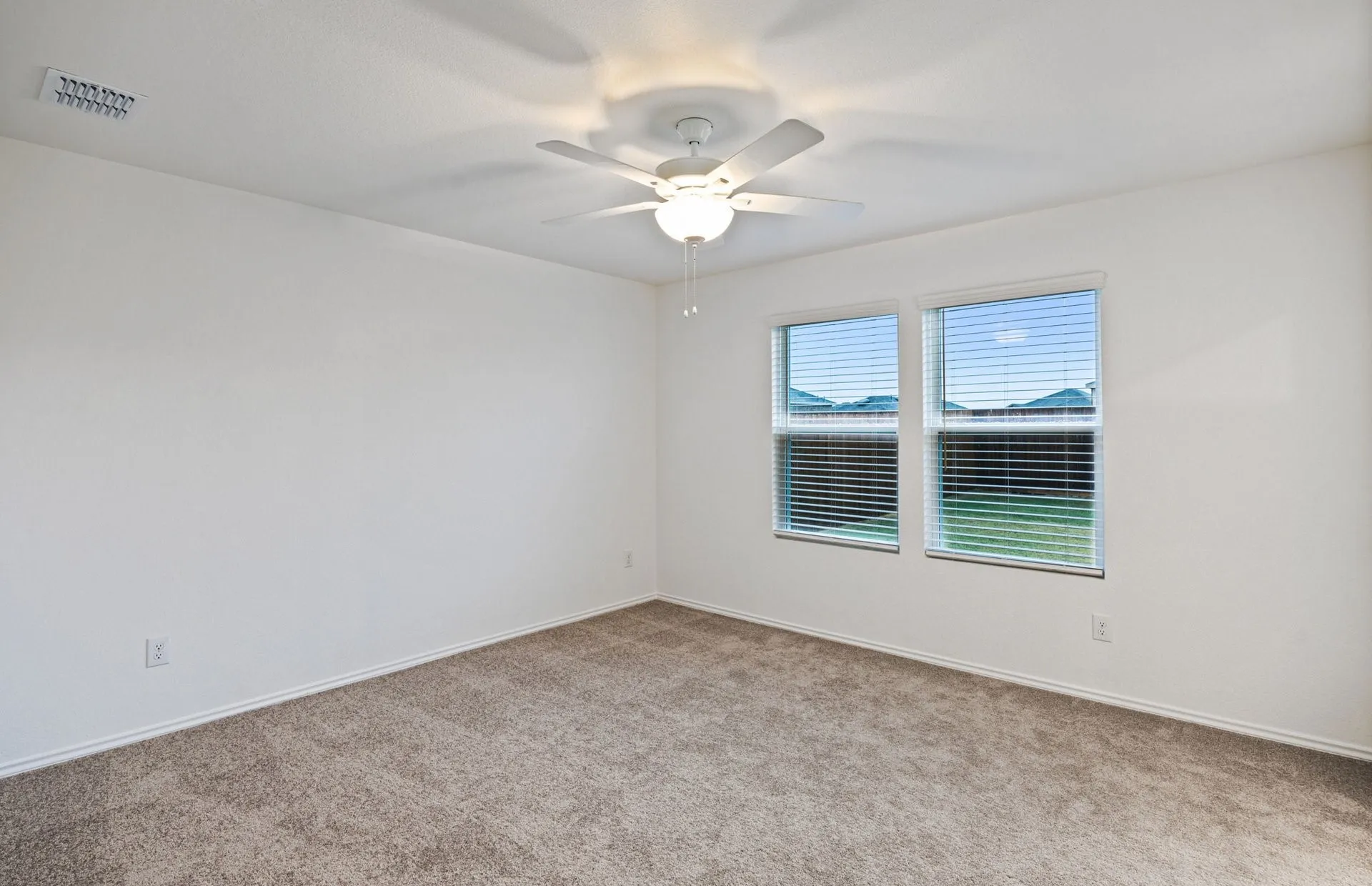Primary bedroom with large window