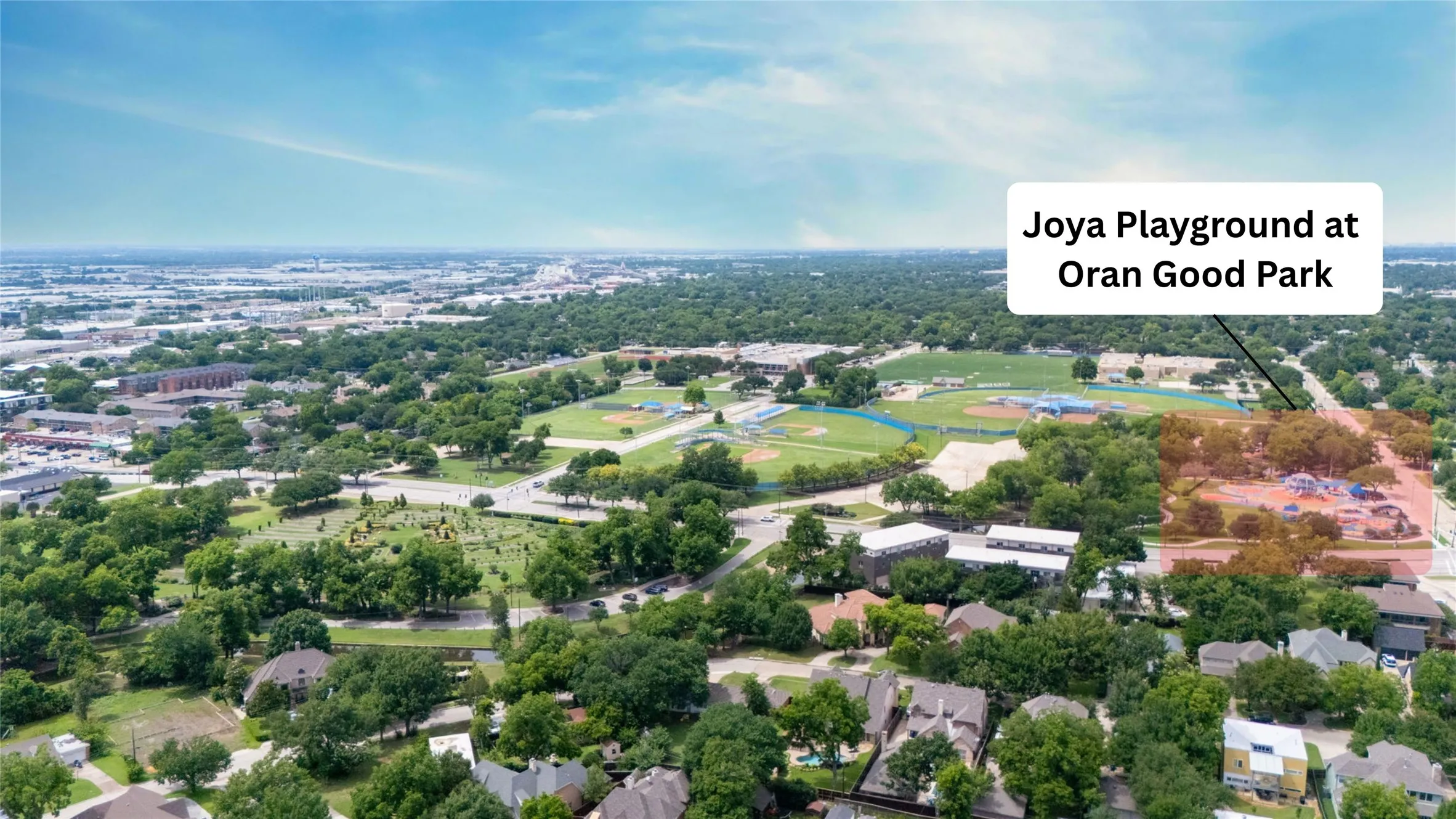 Aerial perspective showcasing a sprawling urban landscape with extensive tree coverage