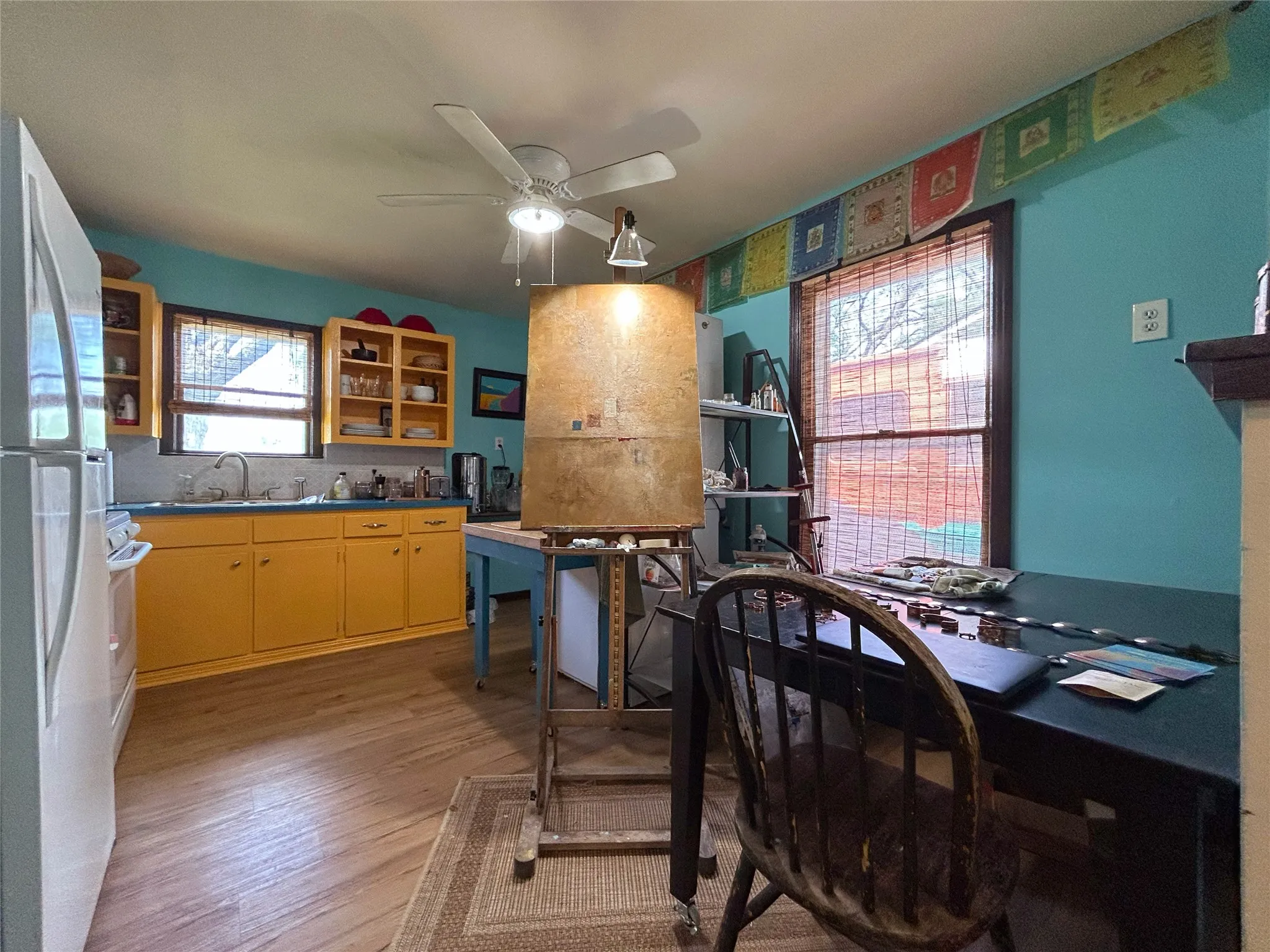 functional kitchen in trendy color scheme open to dining and window over the sink - 516 harlem, waco, tx 76704