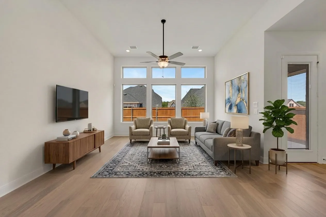Vaulted ceiling with a ceiling fan, light wood-finish flooring, recessed lighting, expansive windows, and a glass-paneled door