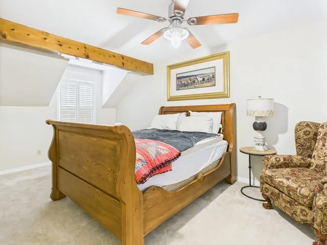 Bedroom featuring carpet floors and a ceiling fan