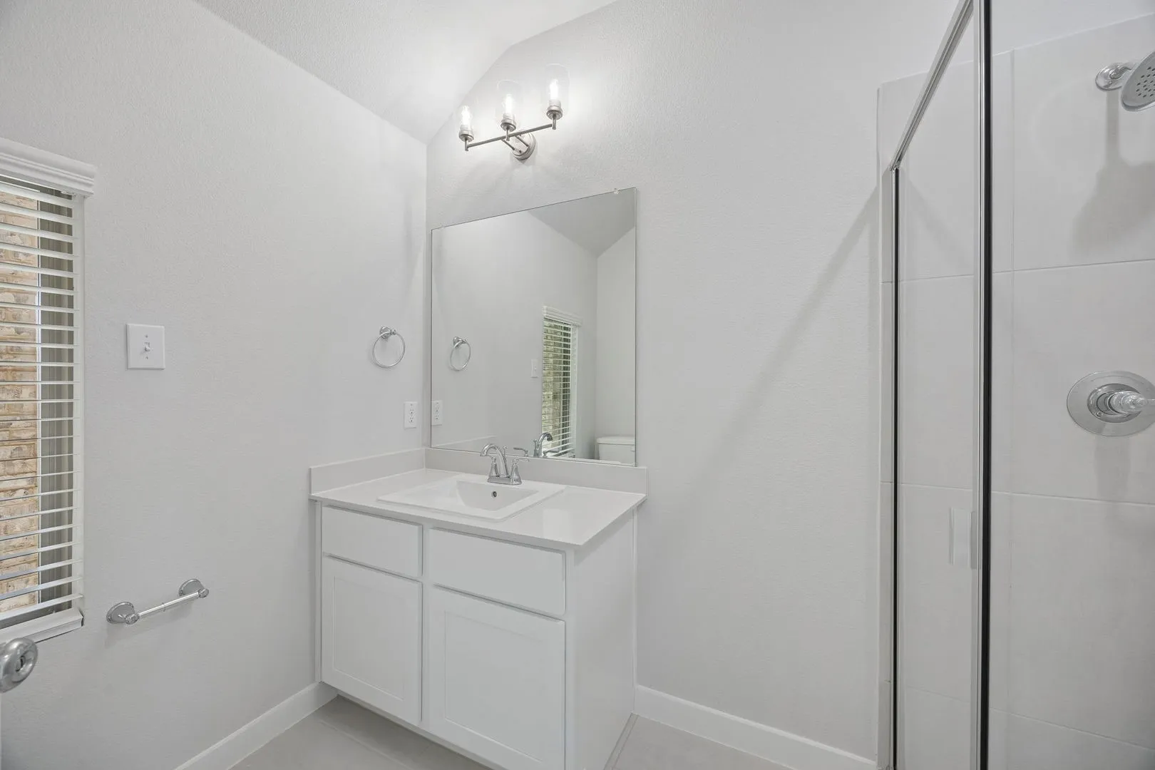 Bathroom in the Masters home plan by Trophy Signature Homes – REPRESENTATIVE PHOTO