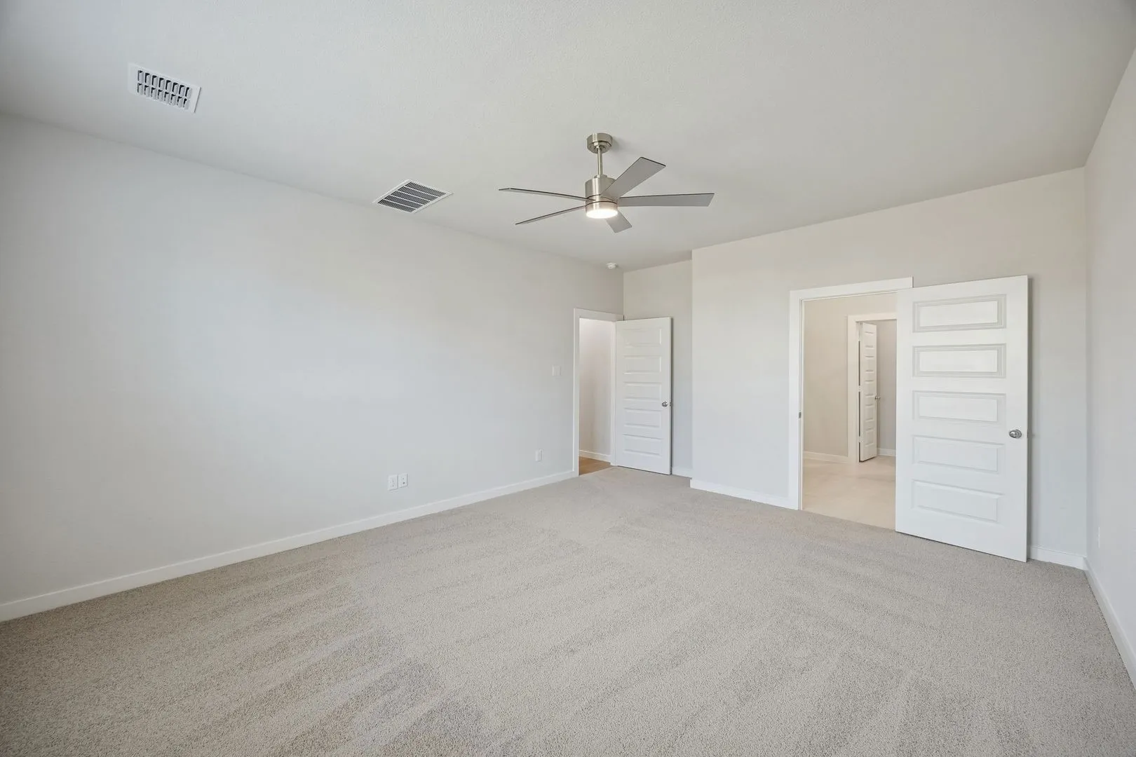 Primary Suite in the Masters home plan by Trophy Signature Homes – REPRESENTATIVE PHOTO