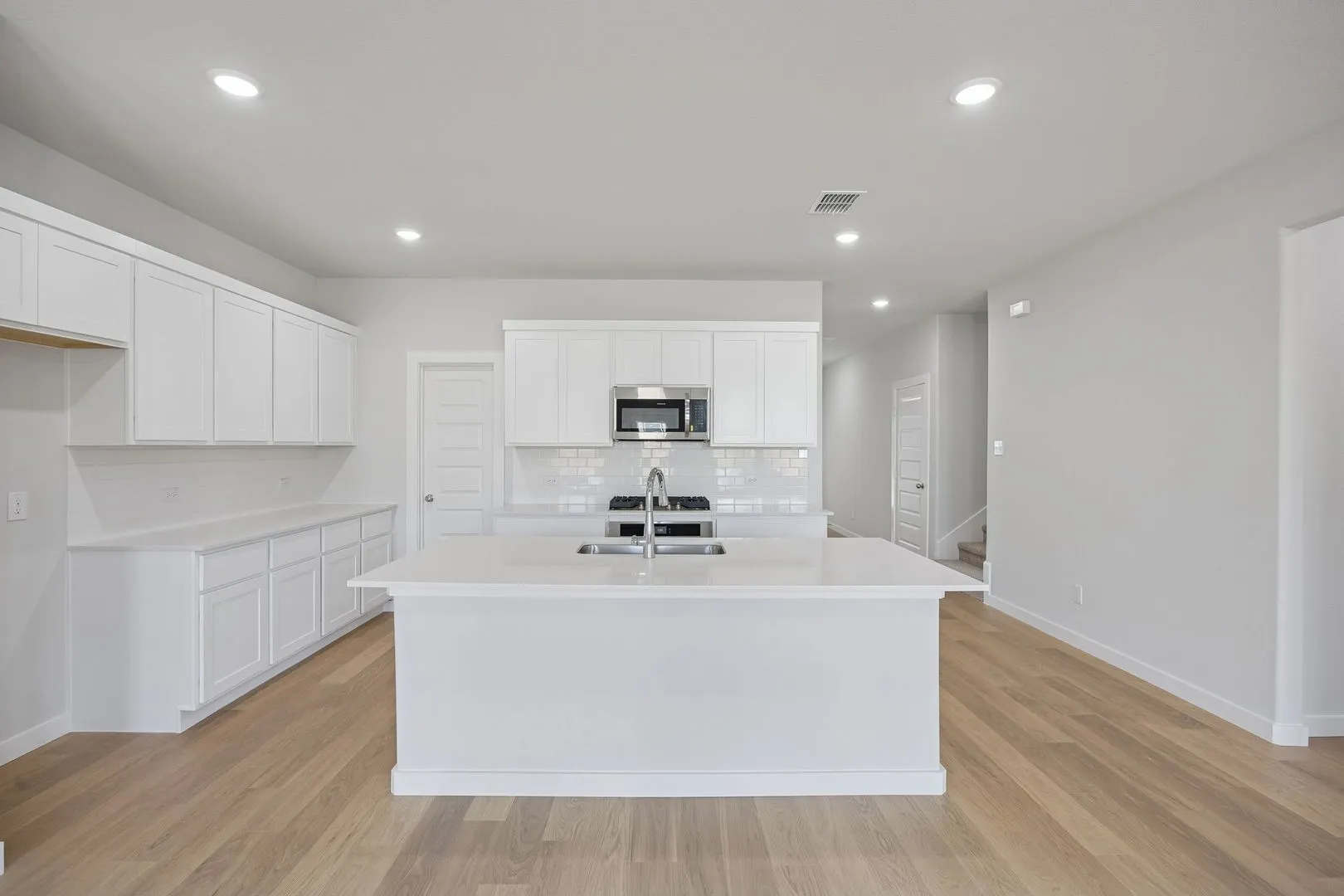 Kitchen in the Masters home plan by Trophy Signature Homes – REPRESENTATIVE PHOTO