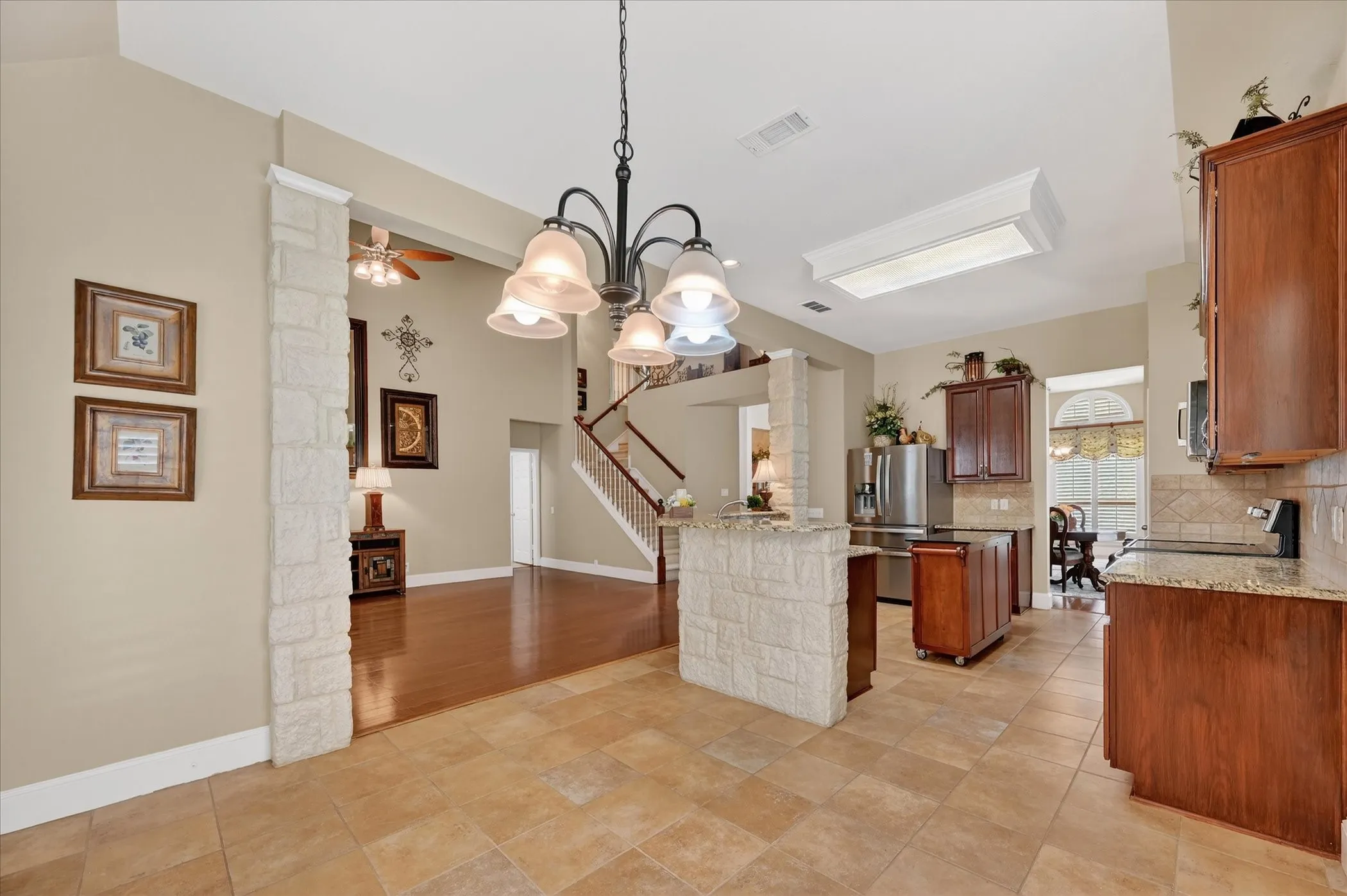 BREAKFAST ROOM LOOKING INTO FAMILY ROOM AND KITCHEN