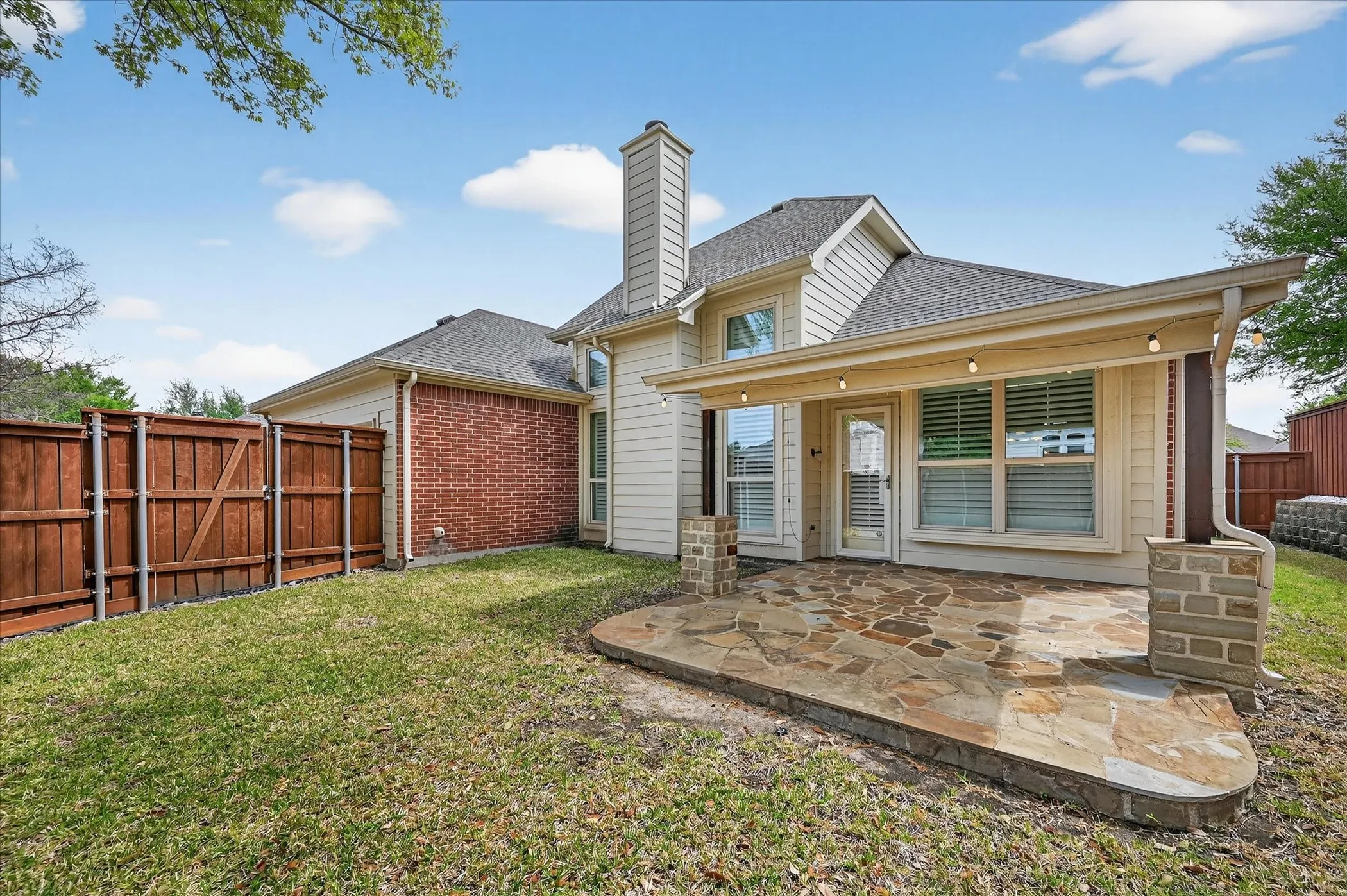 BACKYARD WITH COVERED PATIO