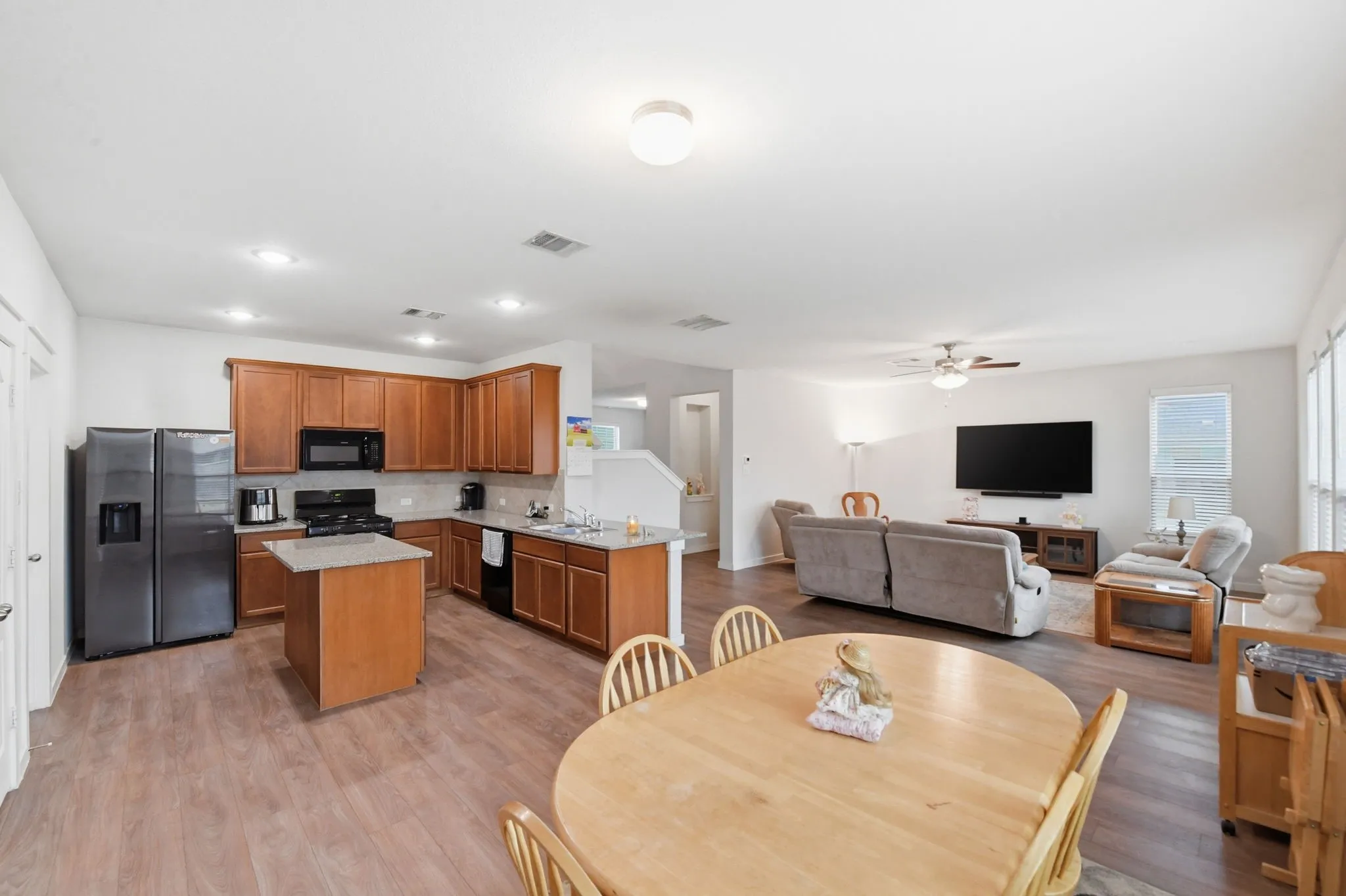 Dining room featuring light wood-style flooring and a ceiling fan