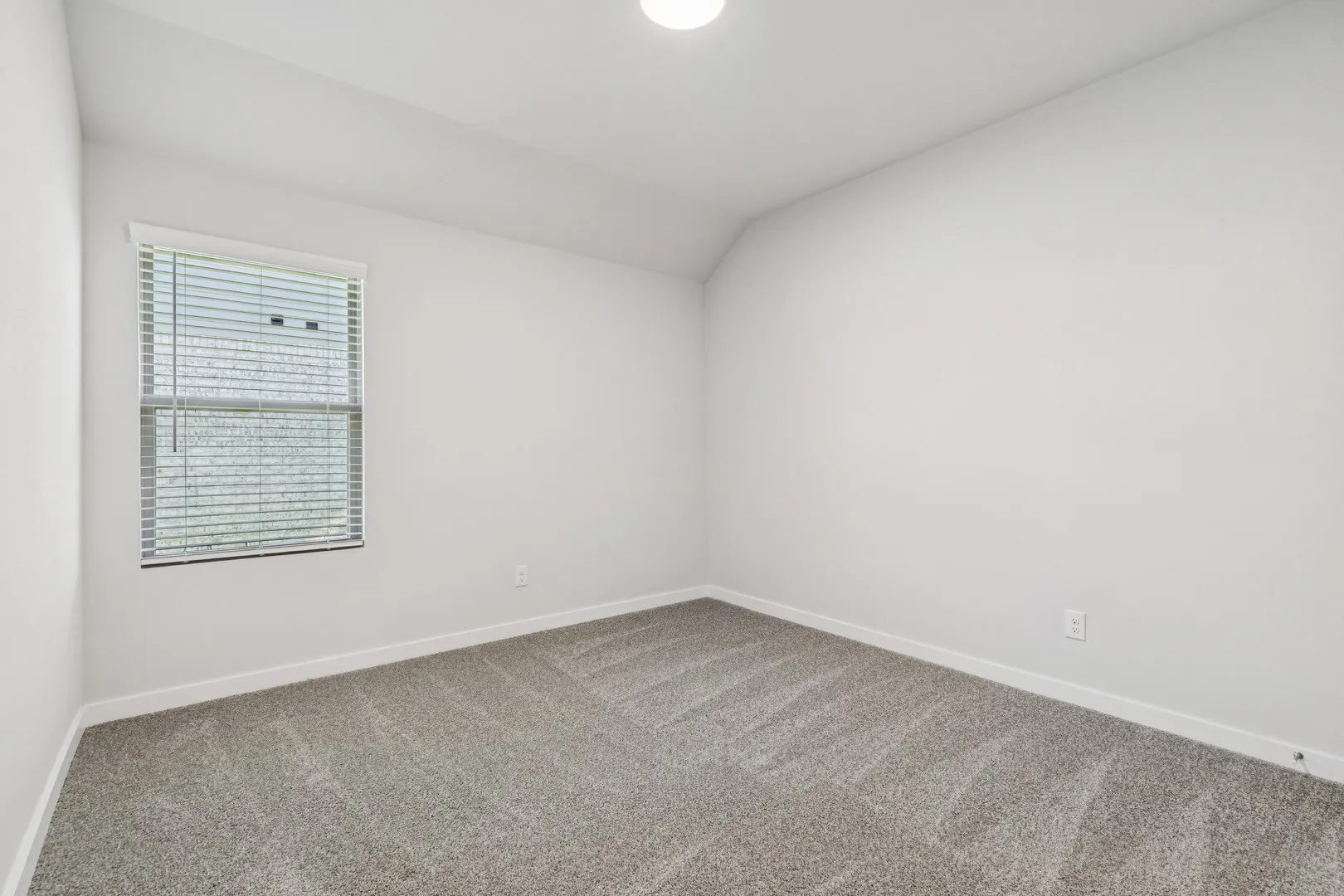 Bedroom in the Oscar home plan by Trophy Signature Homes – REPRESENTATIVE PHOTO