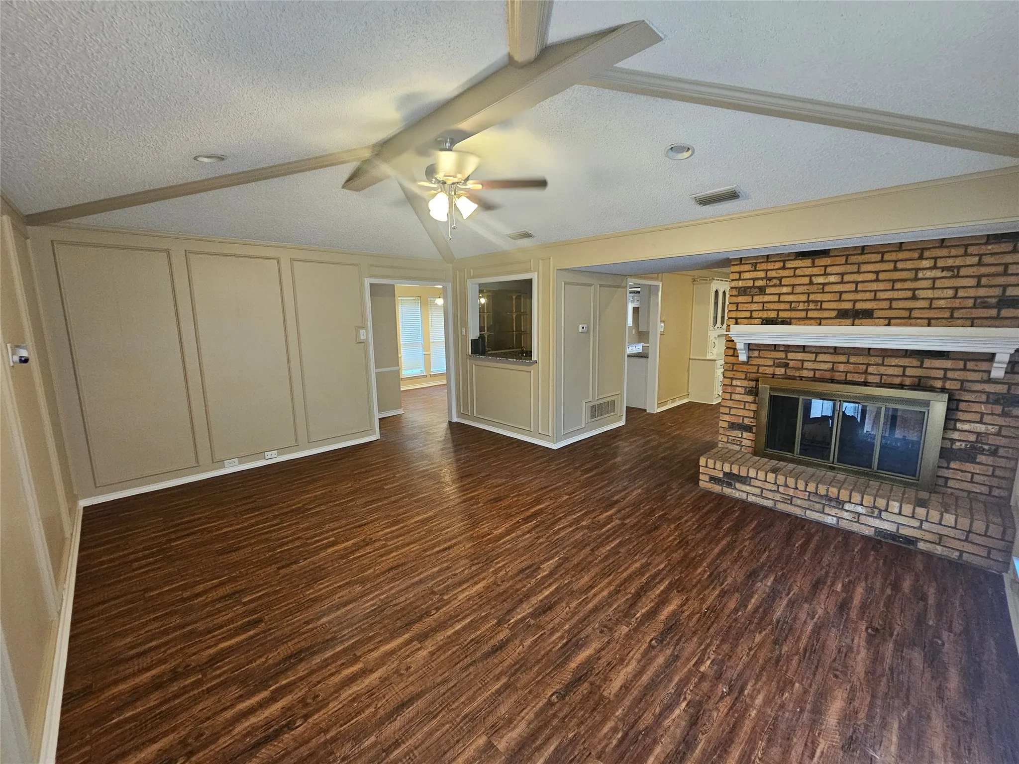 Den with wet bar and double side fireplace