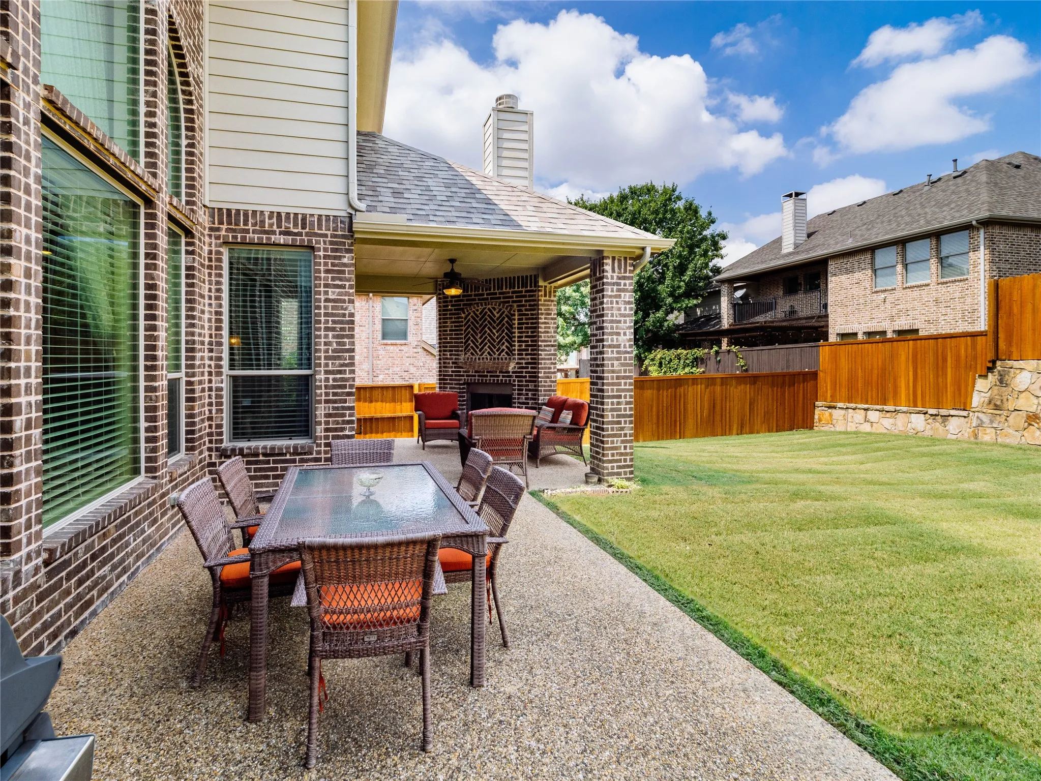 View of patio with ceiling fan and an outdoor living / dining area