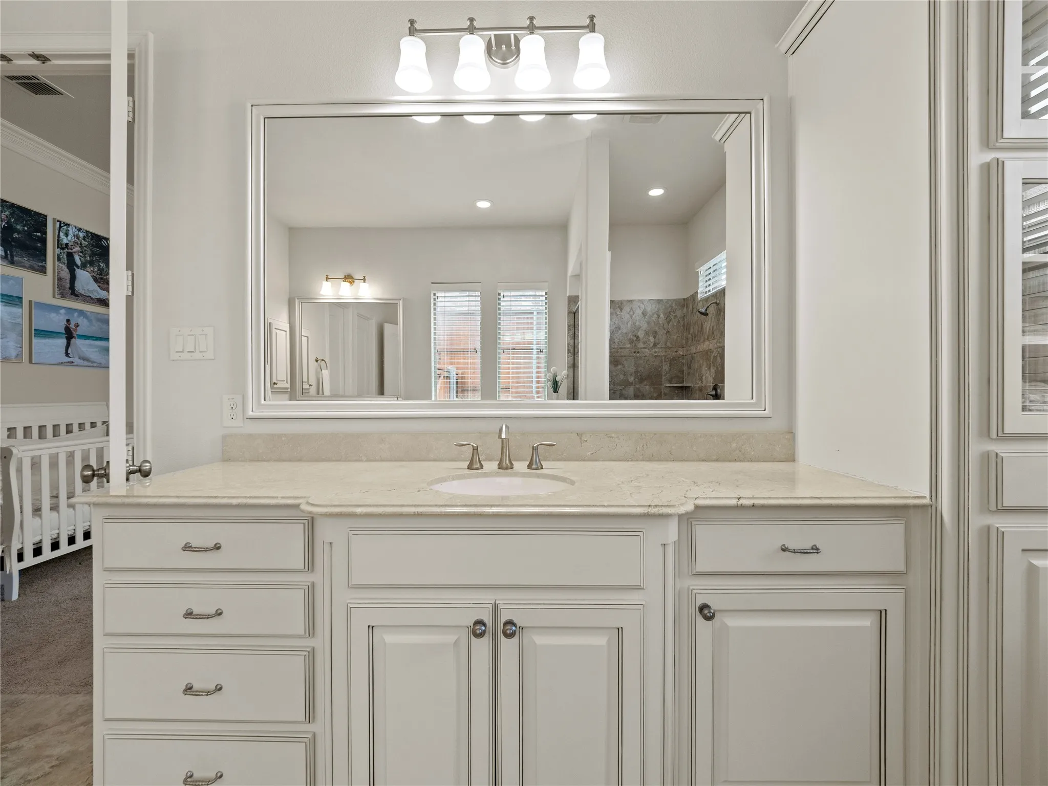 Full bathroom featuring vanity and tiled shower