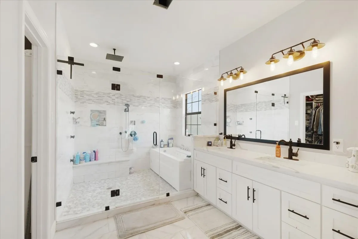 Master Bathroom- double sinks; separate jetted tub, large tile shower with seating bench; Main home