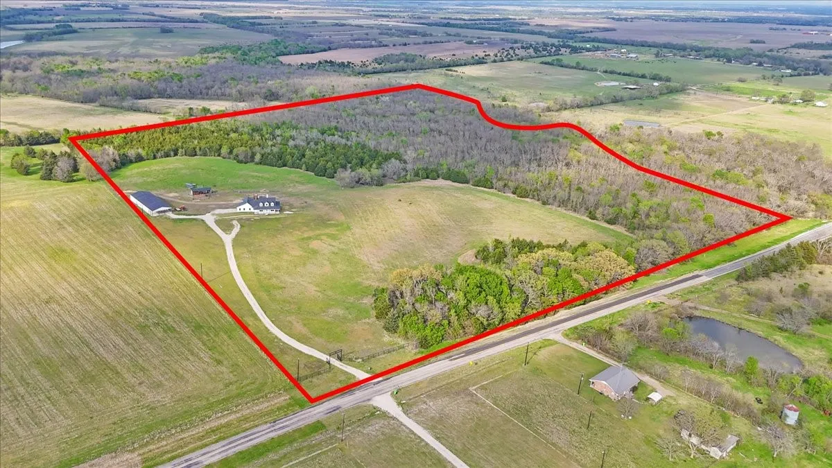 Aerial with approximate property boundary of 51.437 acres and improvements