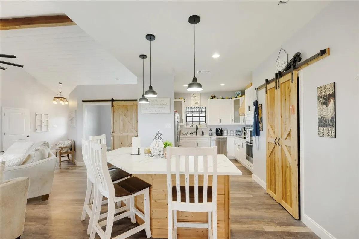 Open concept with breakfast bar, kitchen and living room view; Main home