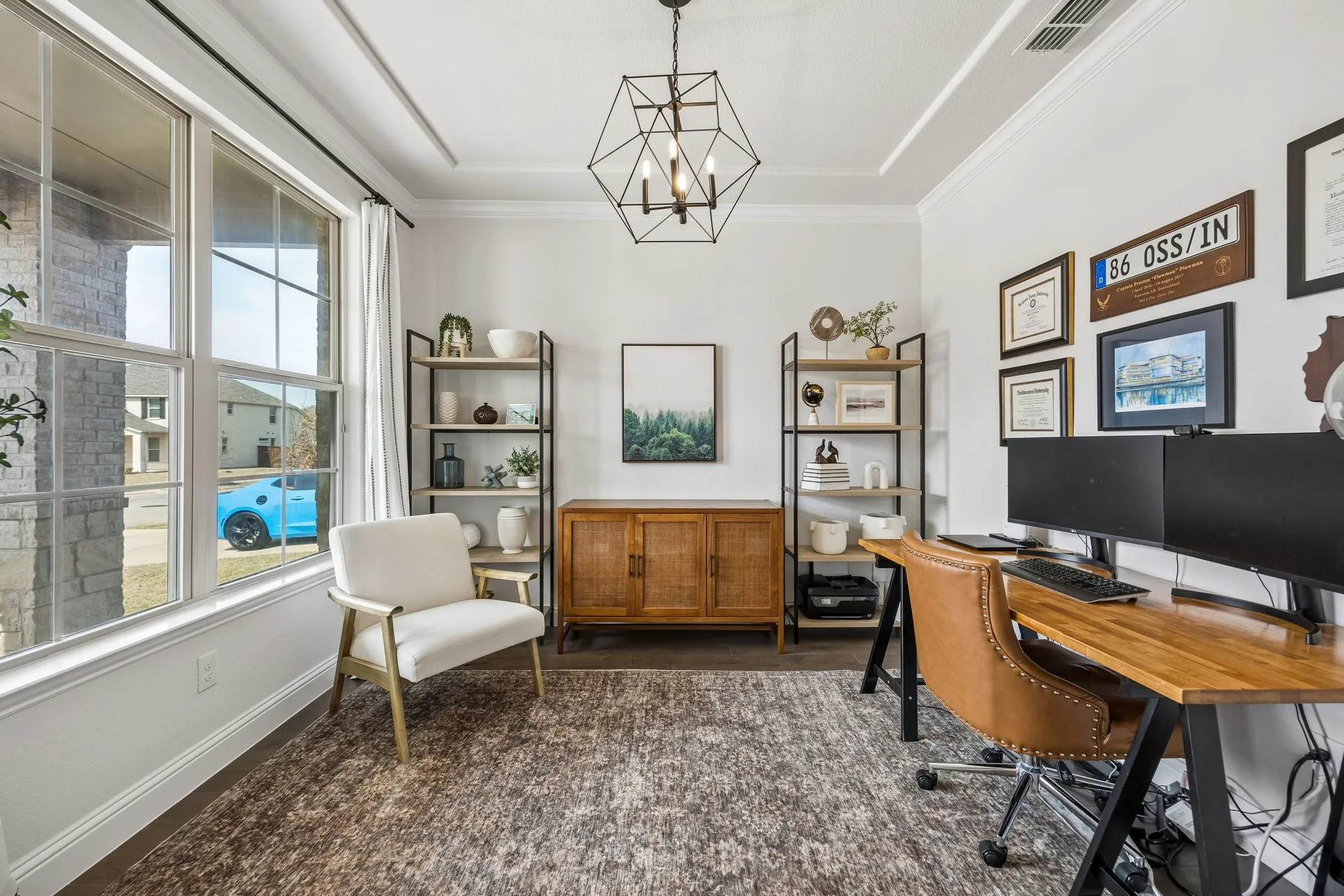 Home office featuring hanging lights and baseboards
