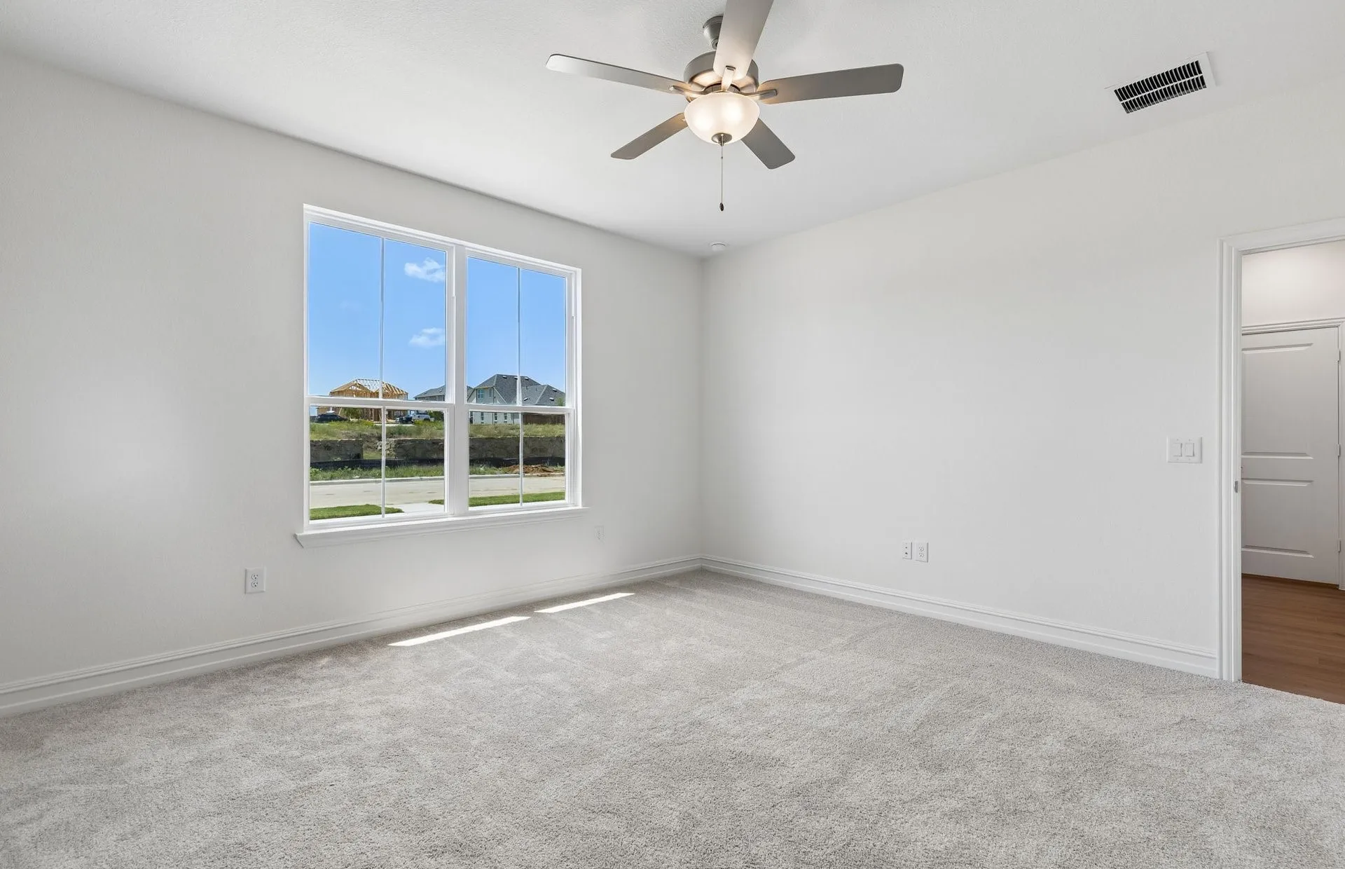 Spacious secondary bedroom with large window