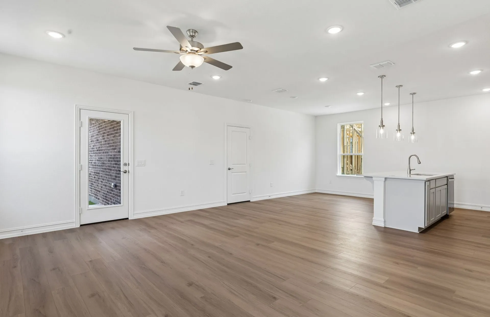 Spacious gathering room with beautiful flooring