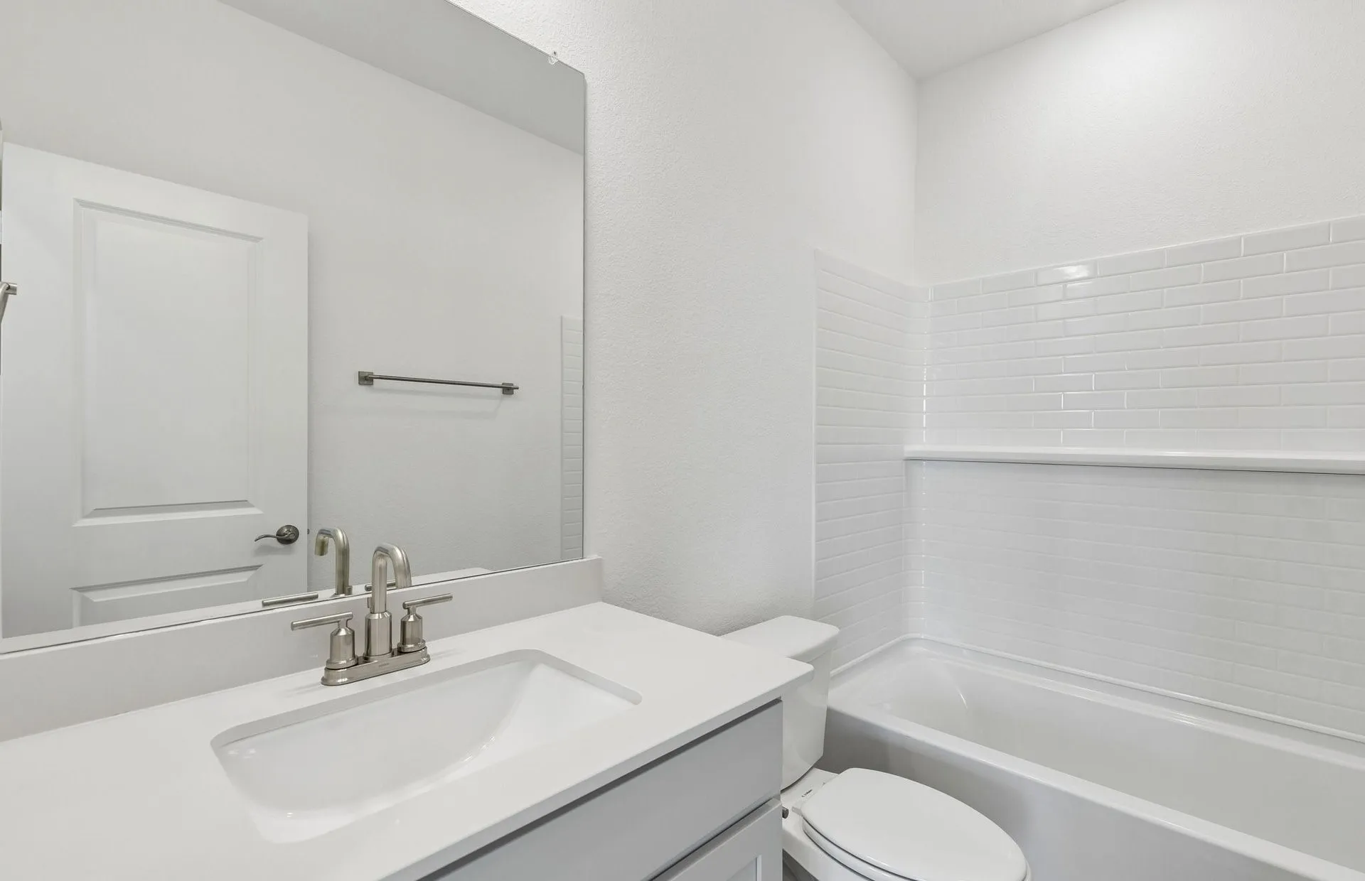 Secondary bath with tile surrounded shower