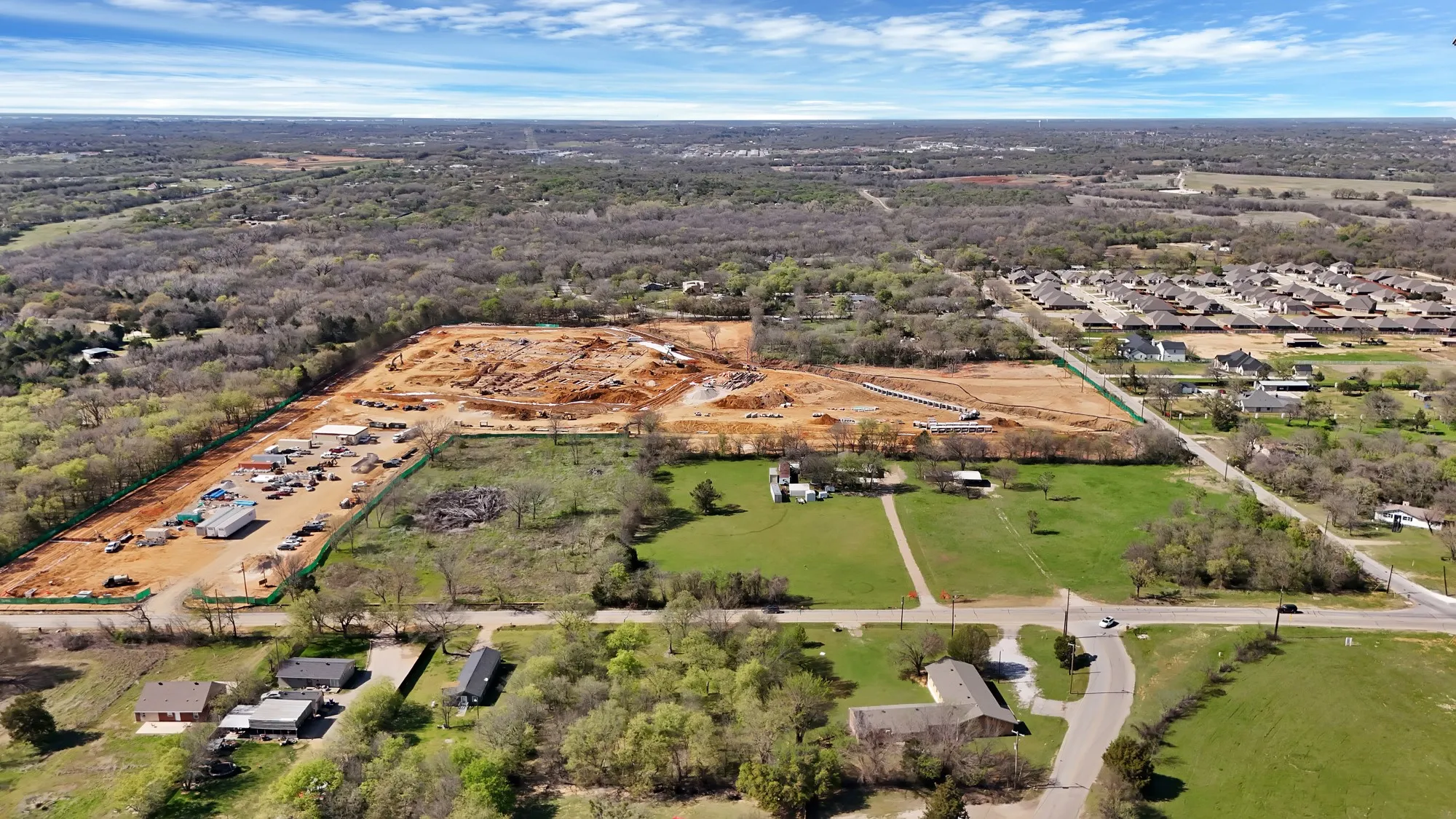 Aerial overview of property's location with a forest