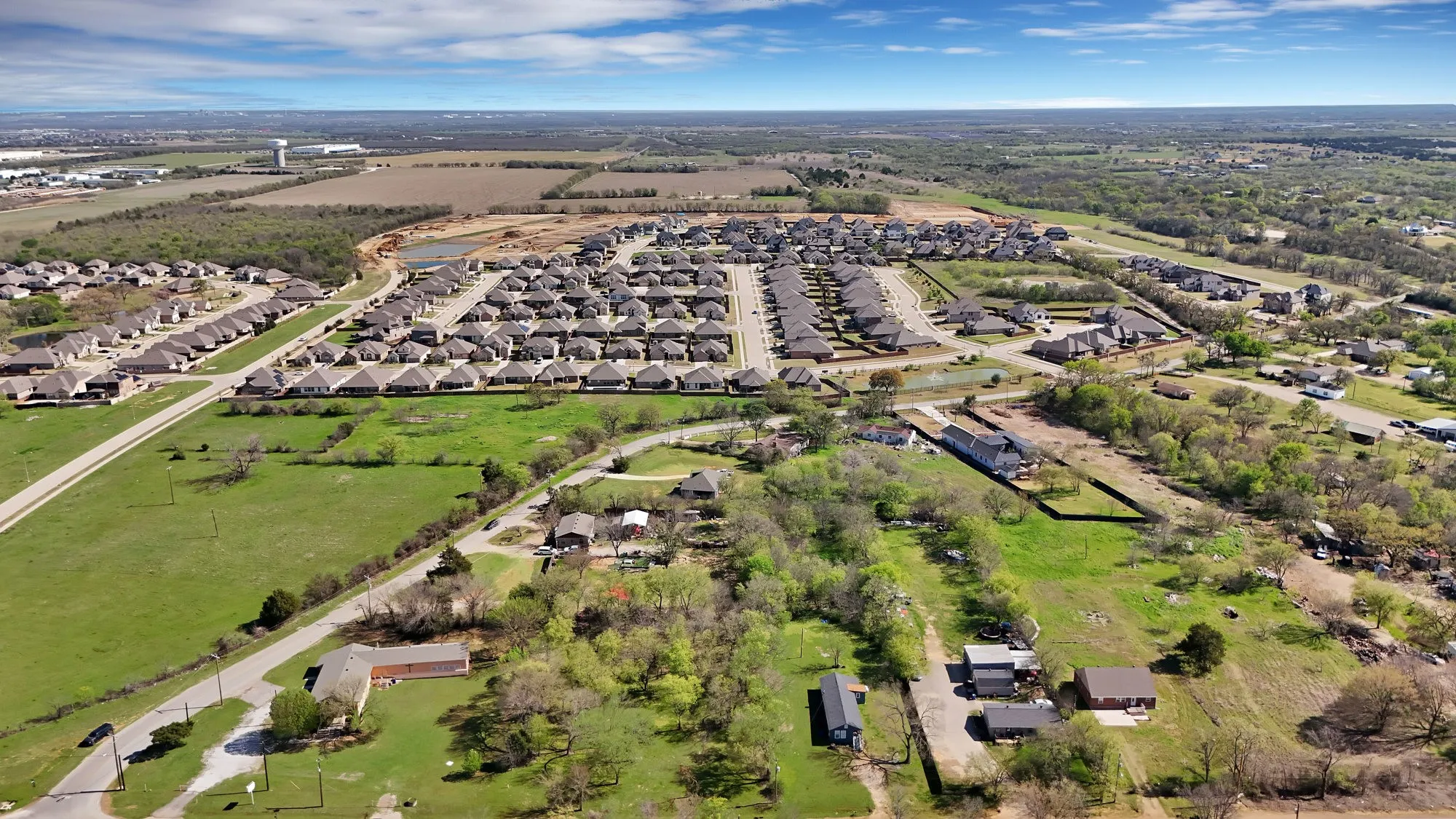 View of property location with nearby suburban area