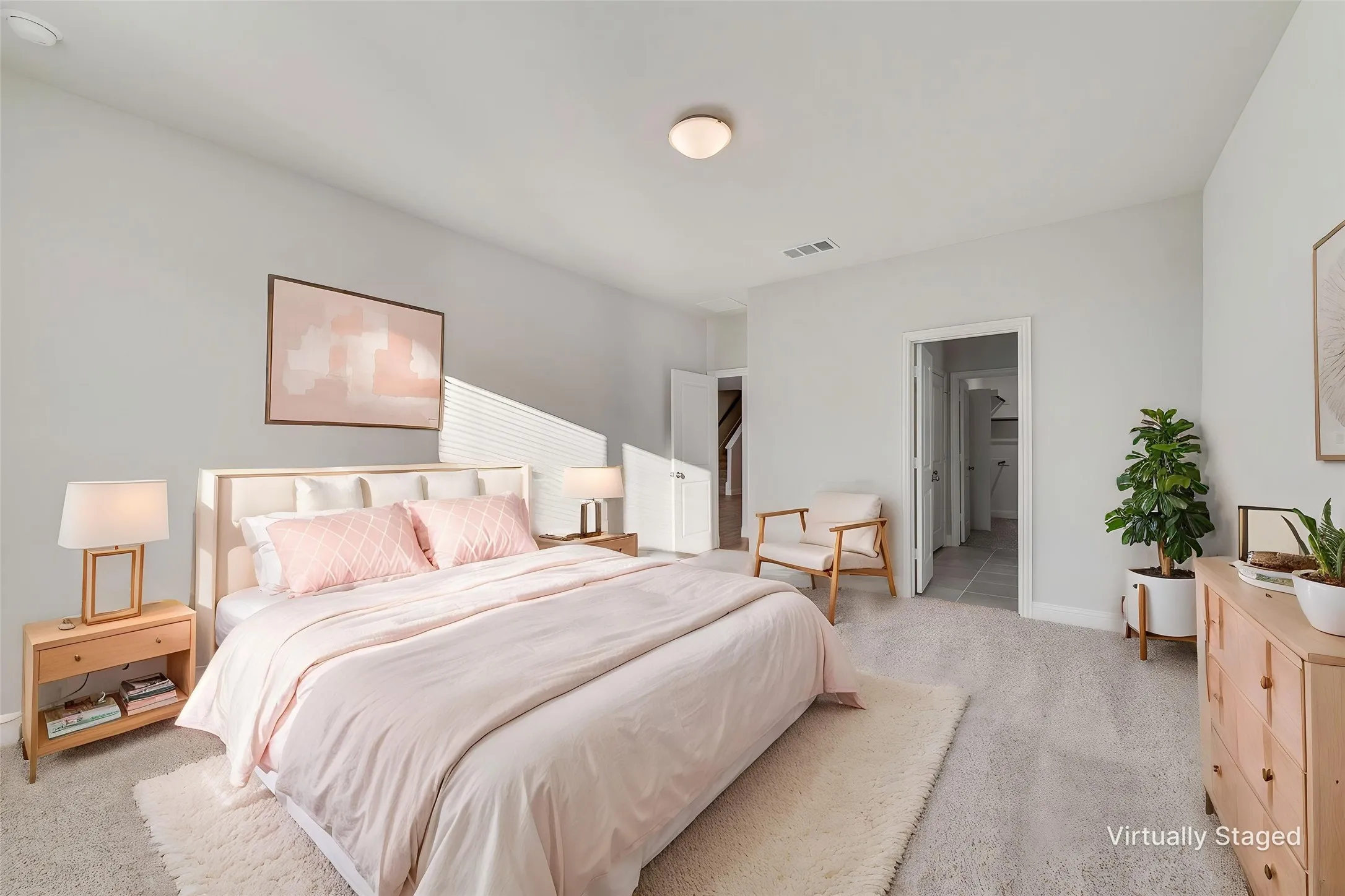 Carpeted flooring, vaulted ceiling, white paneled door, and a built-in closet