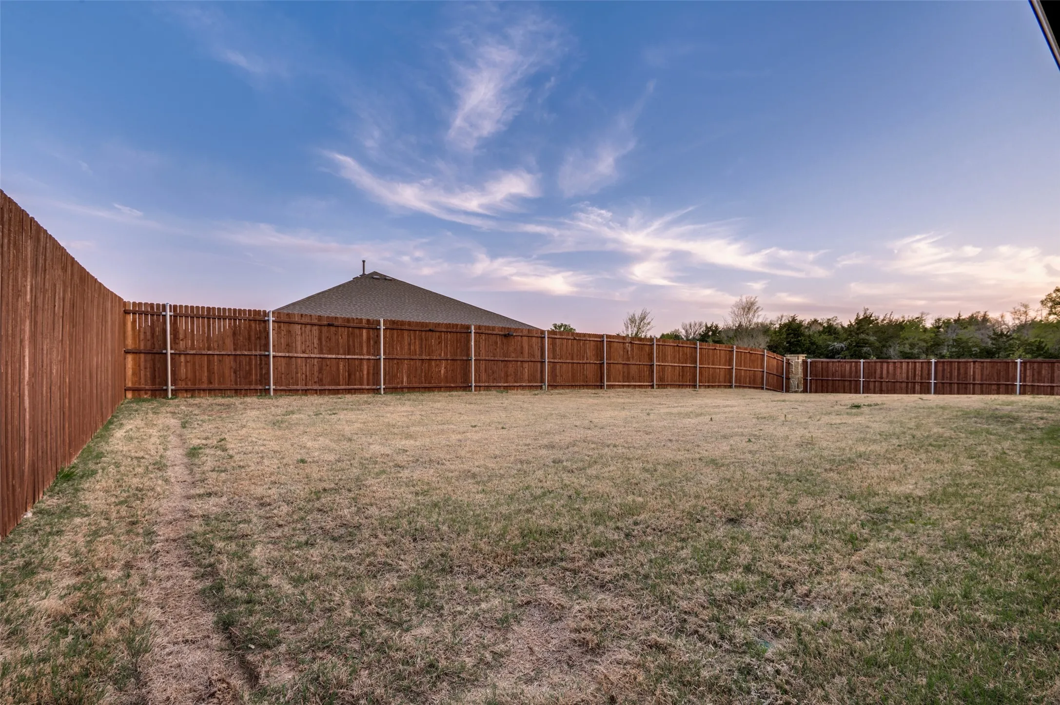 View of fenced backyard