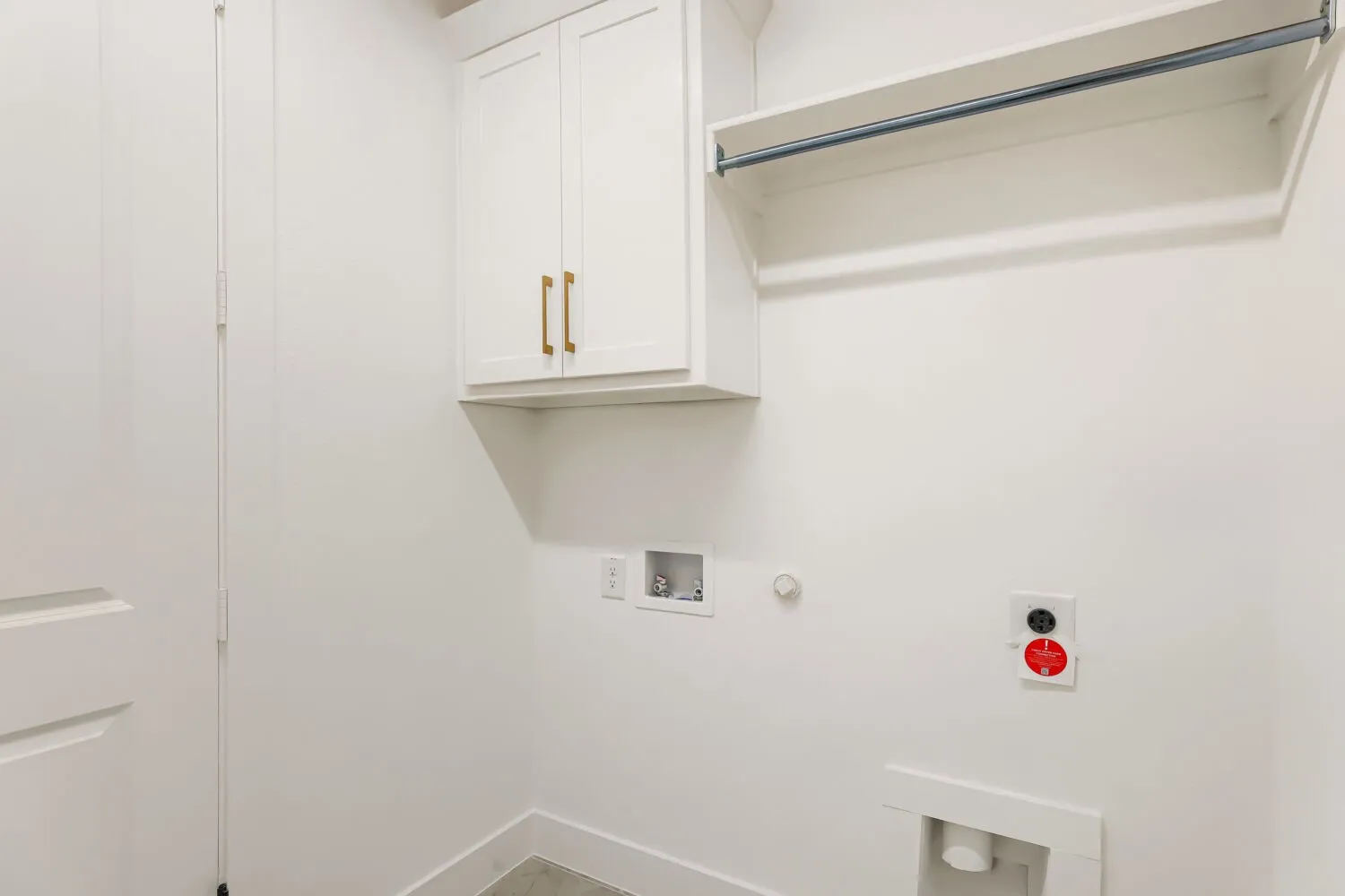 White cabinetry with gold-tone hardware