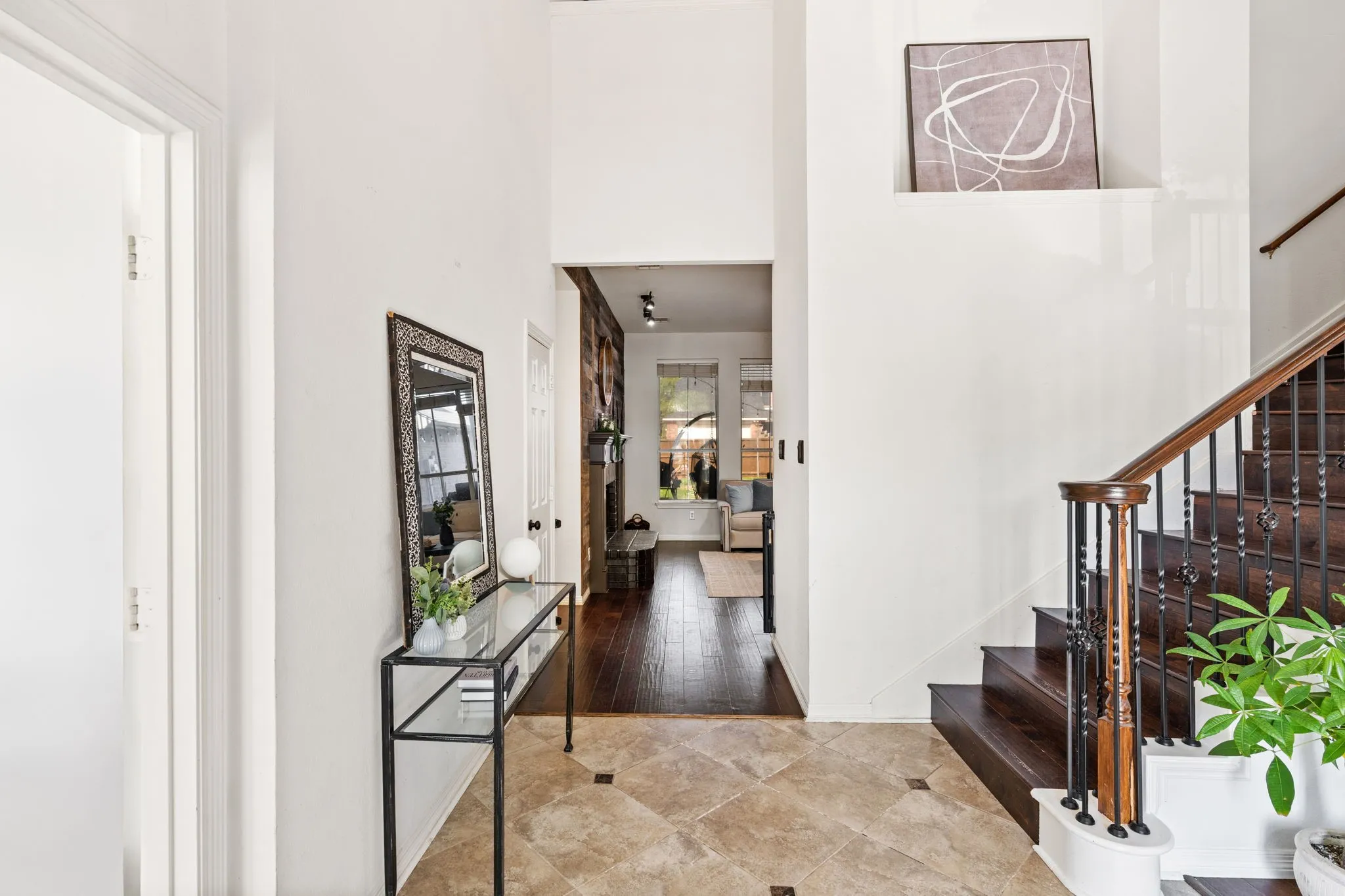 Foyer entrance featuring stairway and a high ceiling