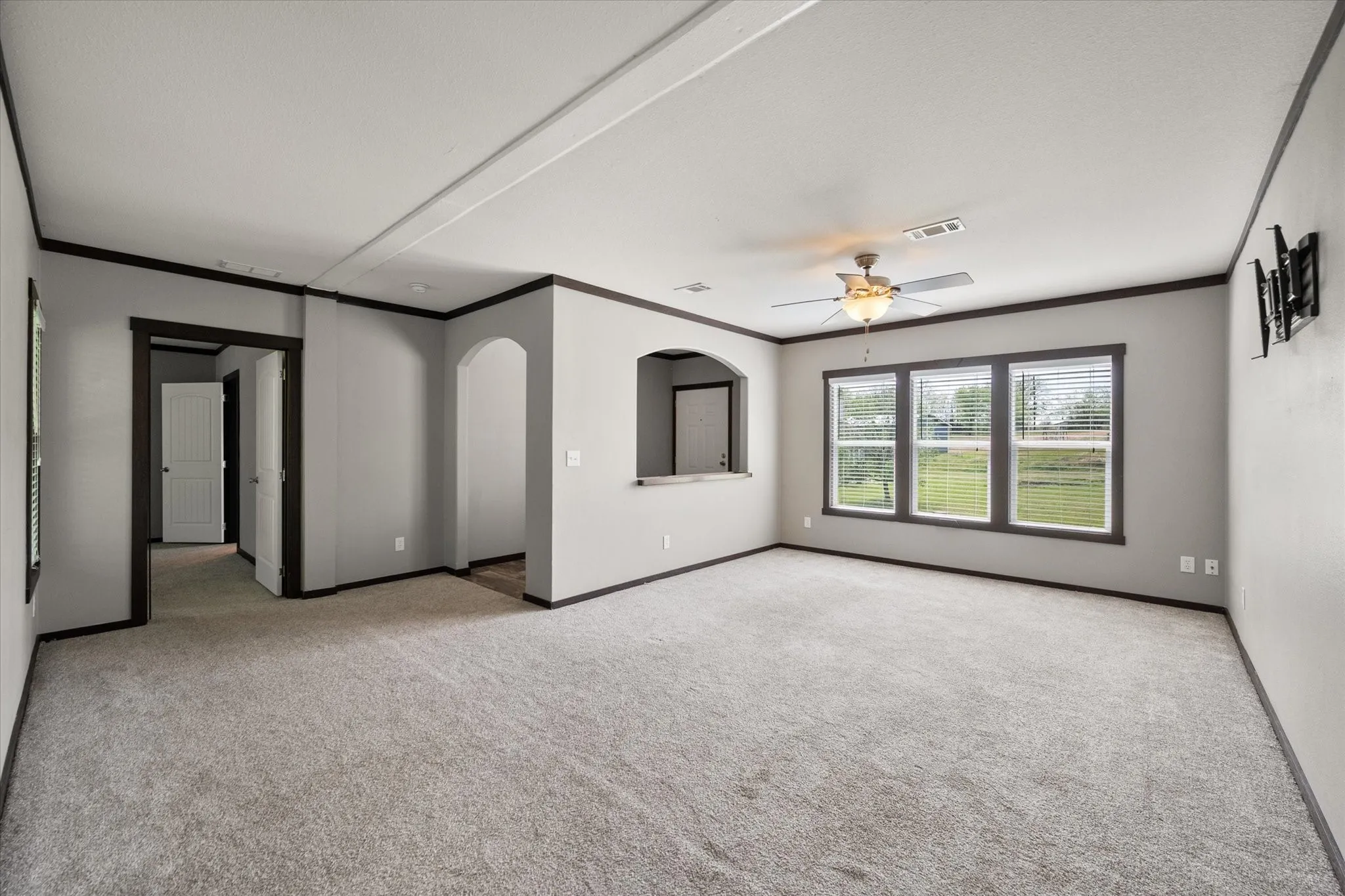 Bright open-concept living room creates an inviting atmosphere for entertaining family and friends