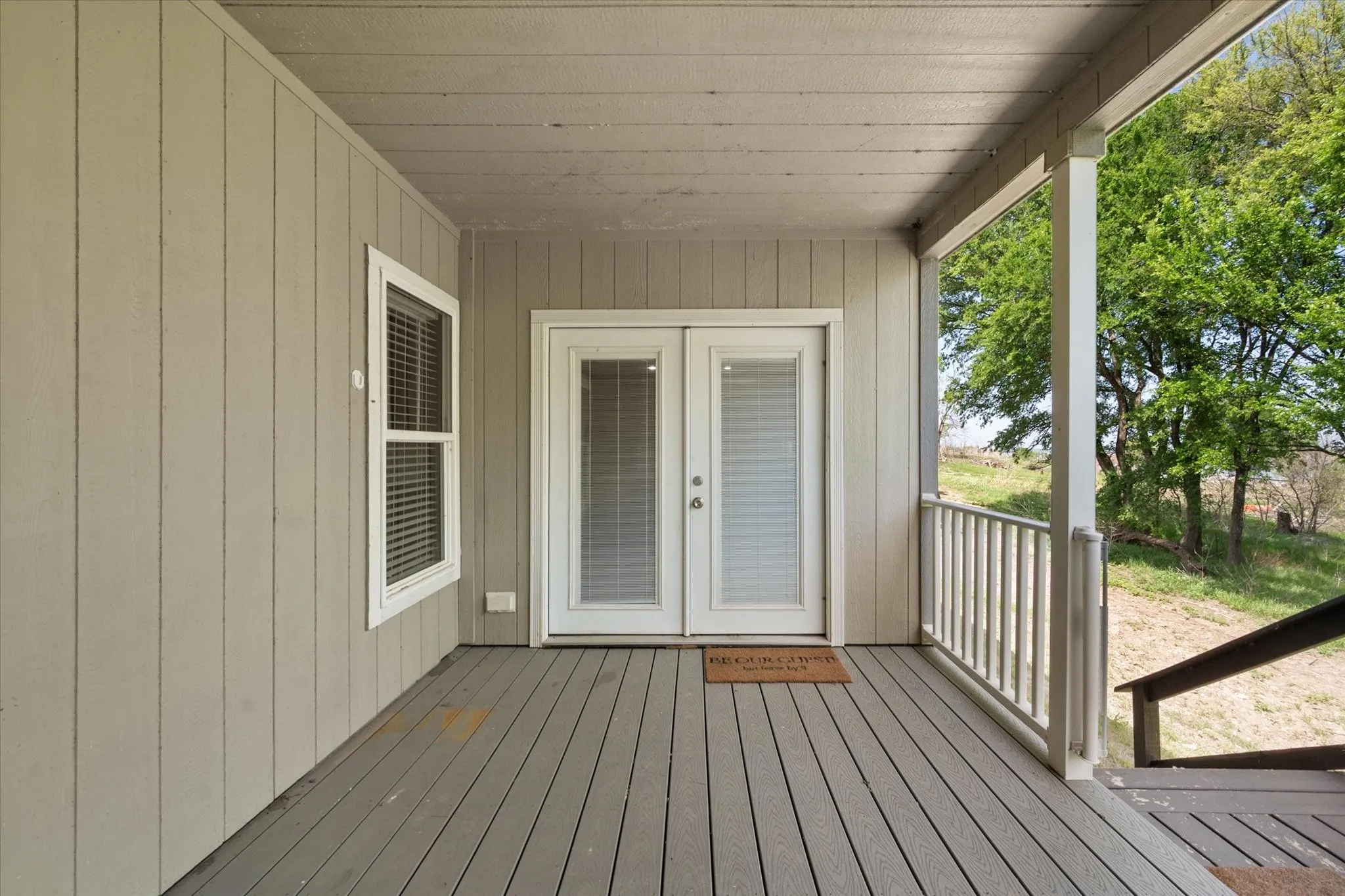 Private rear entrance and covered porch create the perfect setup for relaxing weekends or rental guest enjoyment.