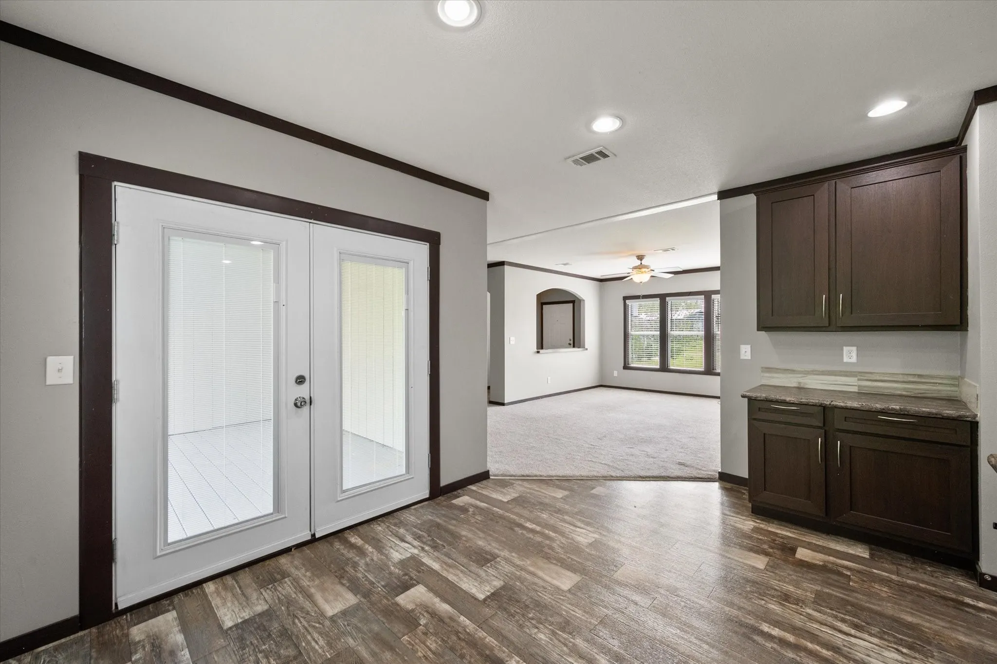 Dining area with backyard access creates an easy indoor-outdoor flow for relaxed lake area living.