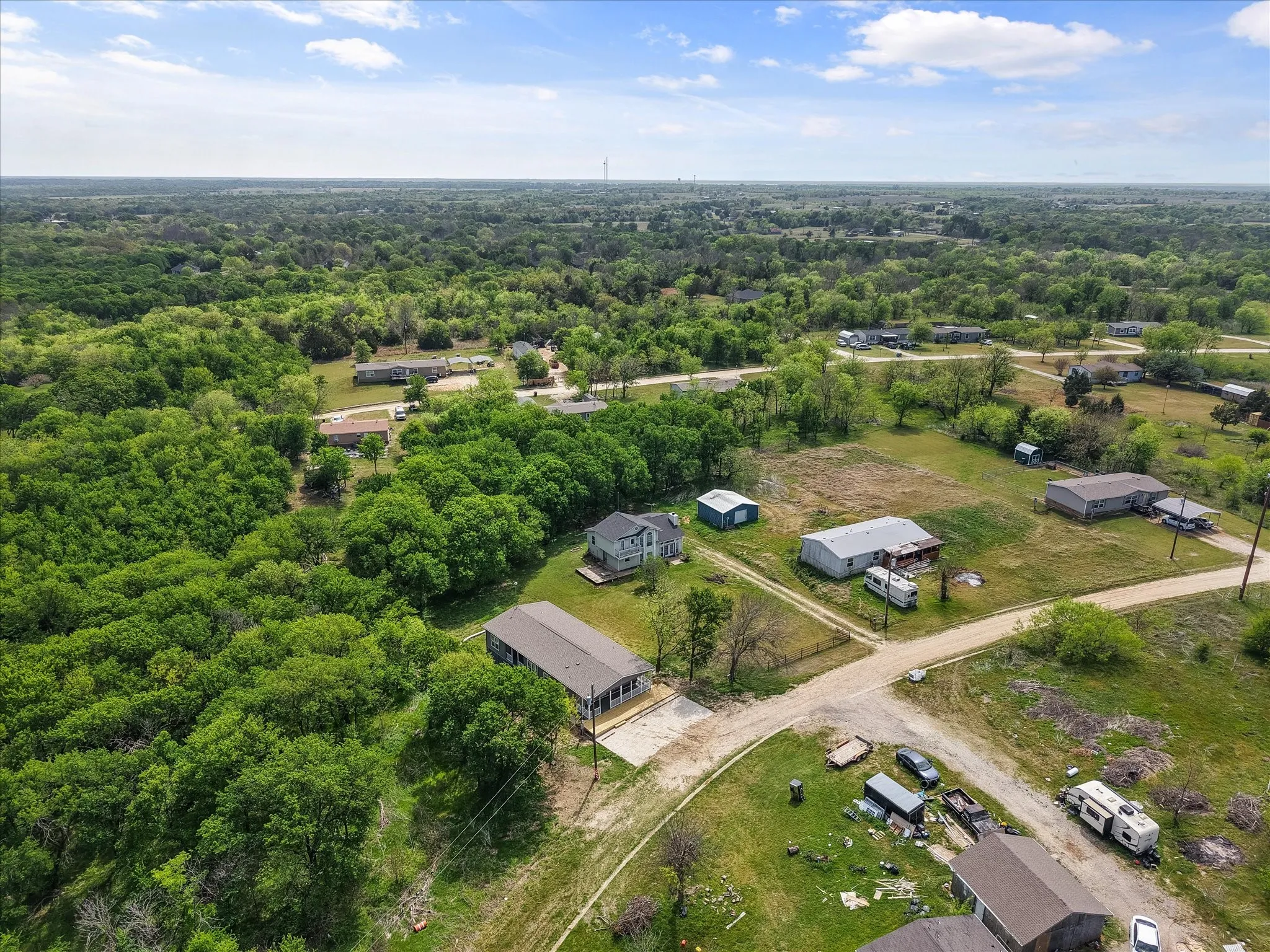 Expansive aerial view highlights the spacious neighborhood setting popular with lake buyers relocating from Dallas and Houston.
