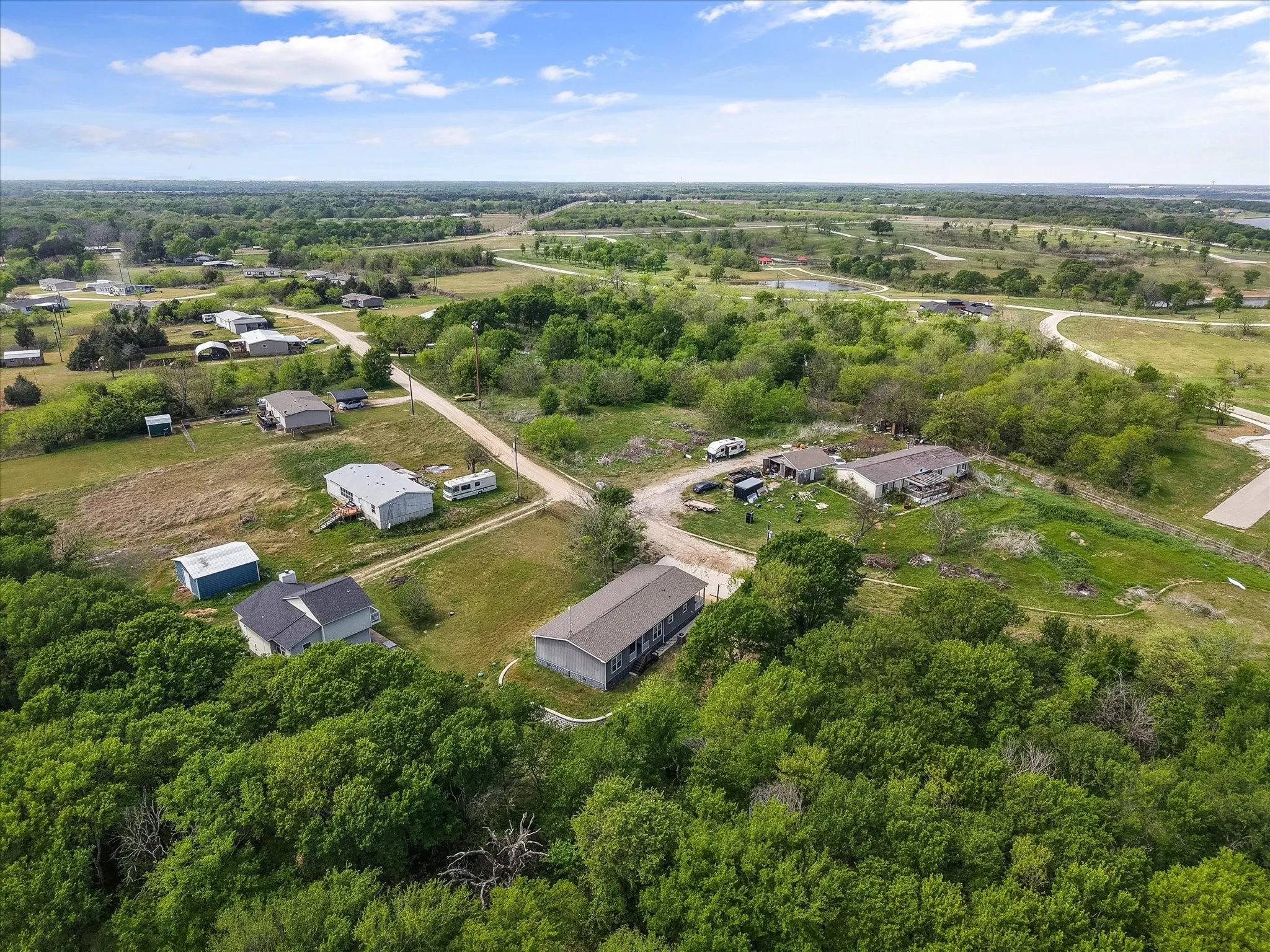 Sweeping aerial view showcases close proximity to Richland Chambers Lake and the relaxed Central Texas lake lifestyle.