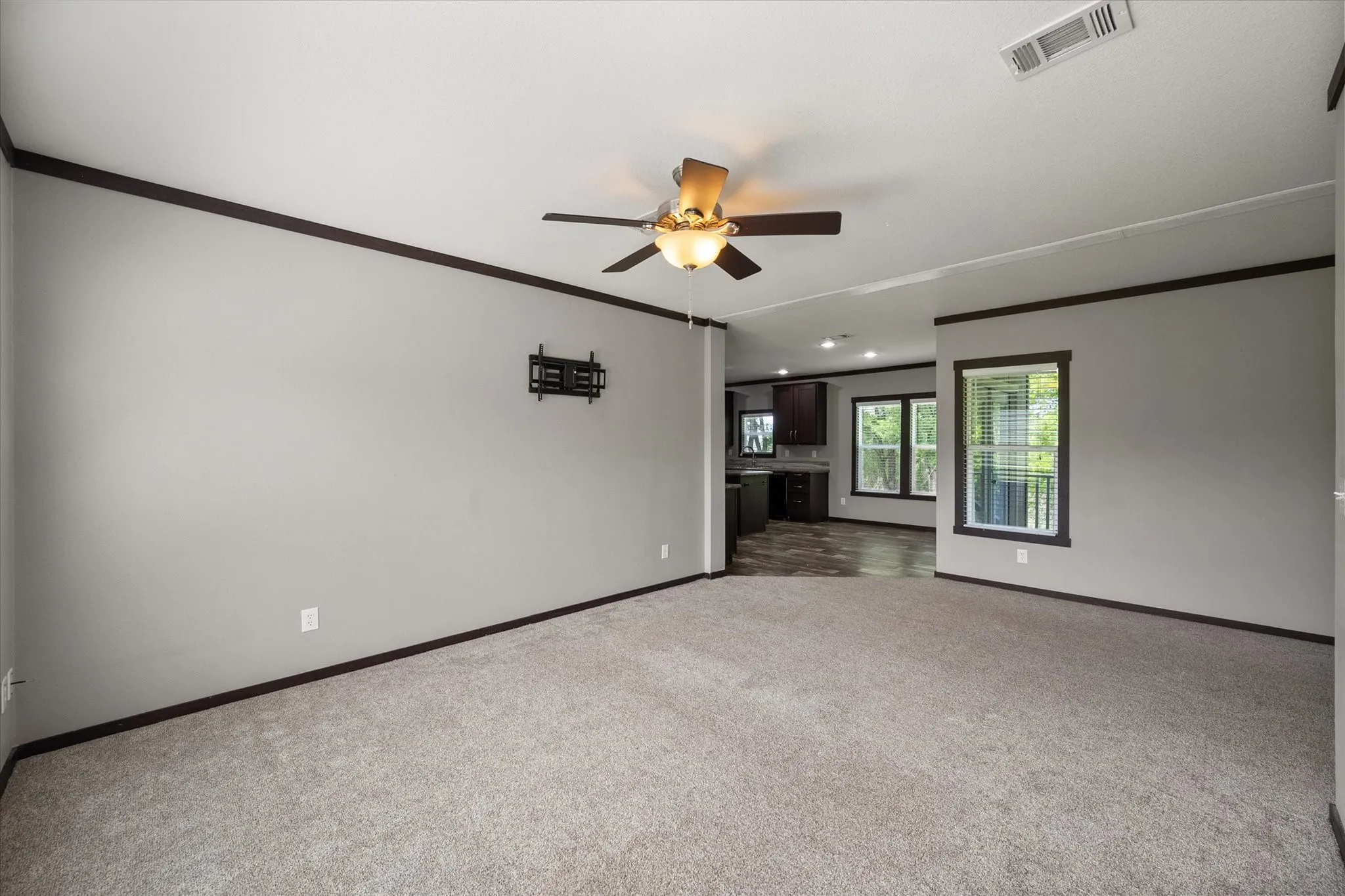 Open living spaces flow seamlessly toward the kitchen and dining areas for easy entertaining and daily comfort.