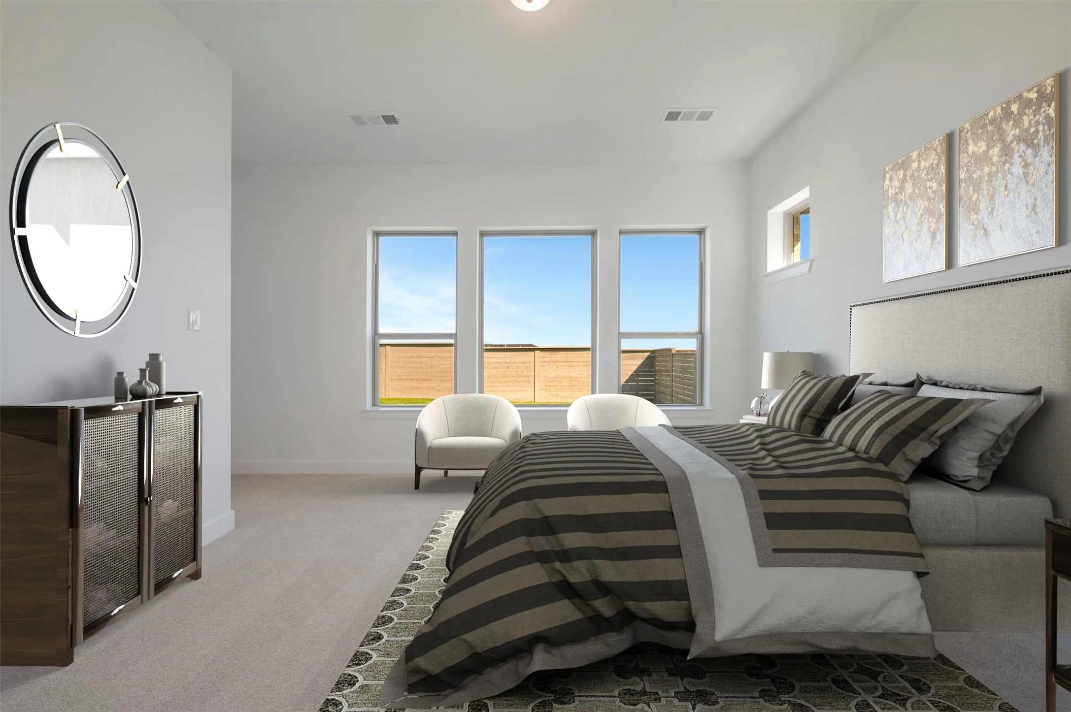 Spacious room featuring light gray carpet flooring and multiple windows, including three large vertical windows and one horizontal transom window
