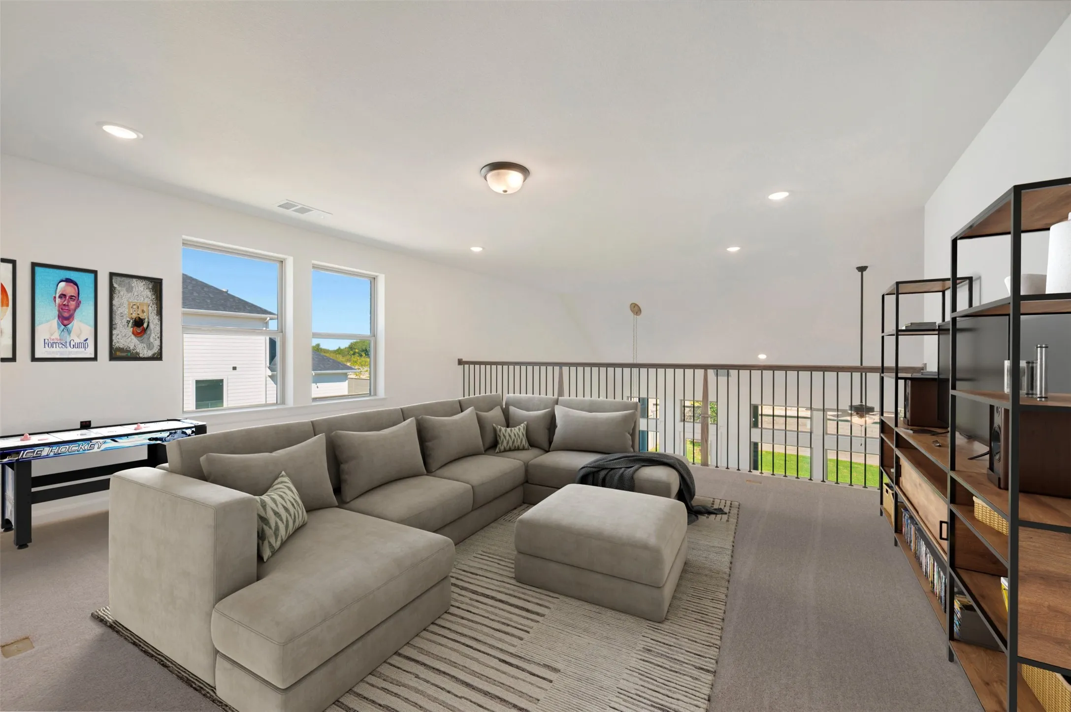 Spacious loft area featuring carpet flooring and multiple windows