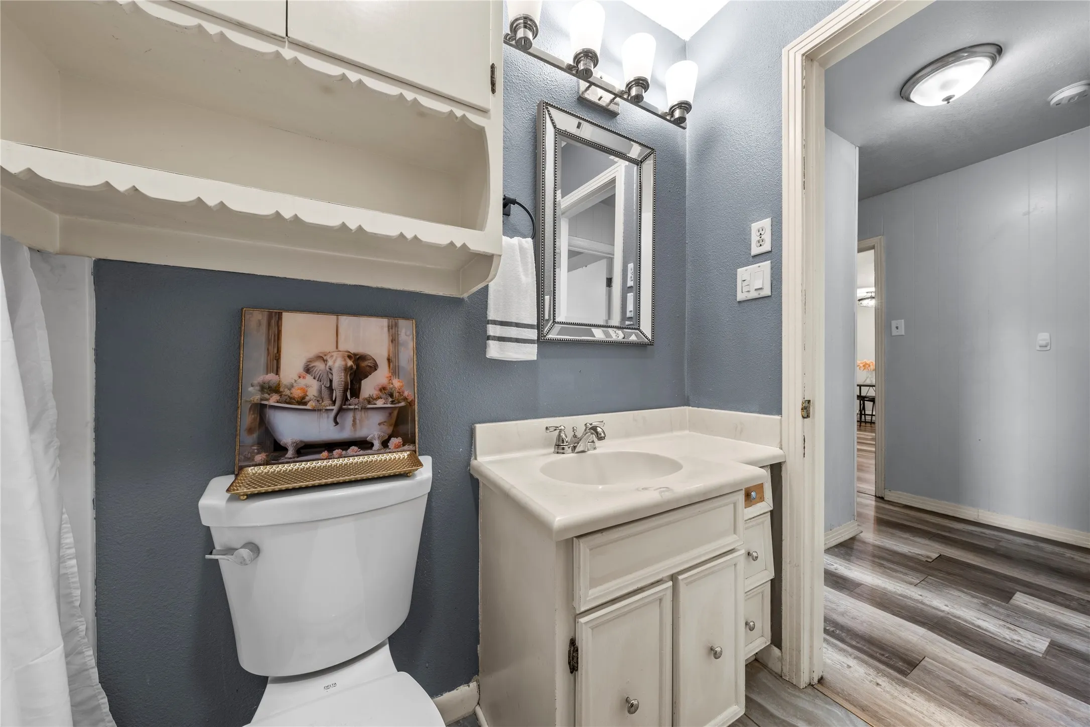 Bathroom with vanity and light wood-type flooring