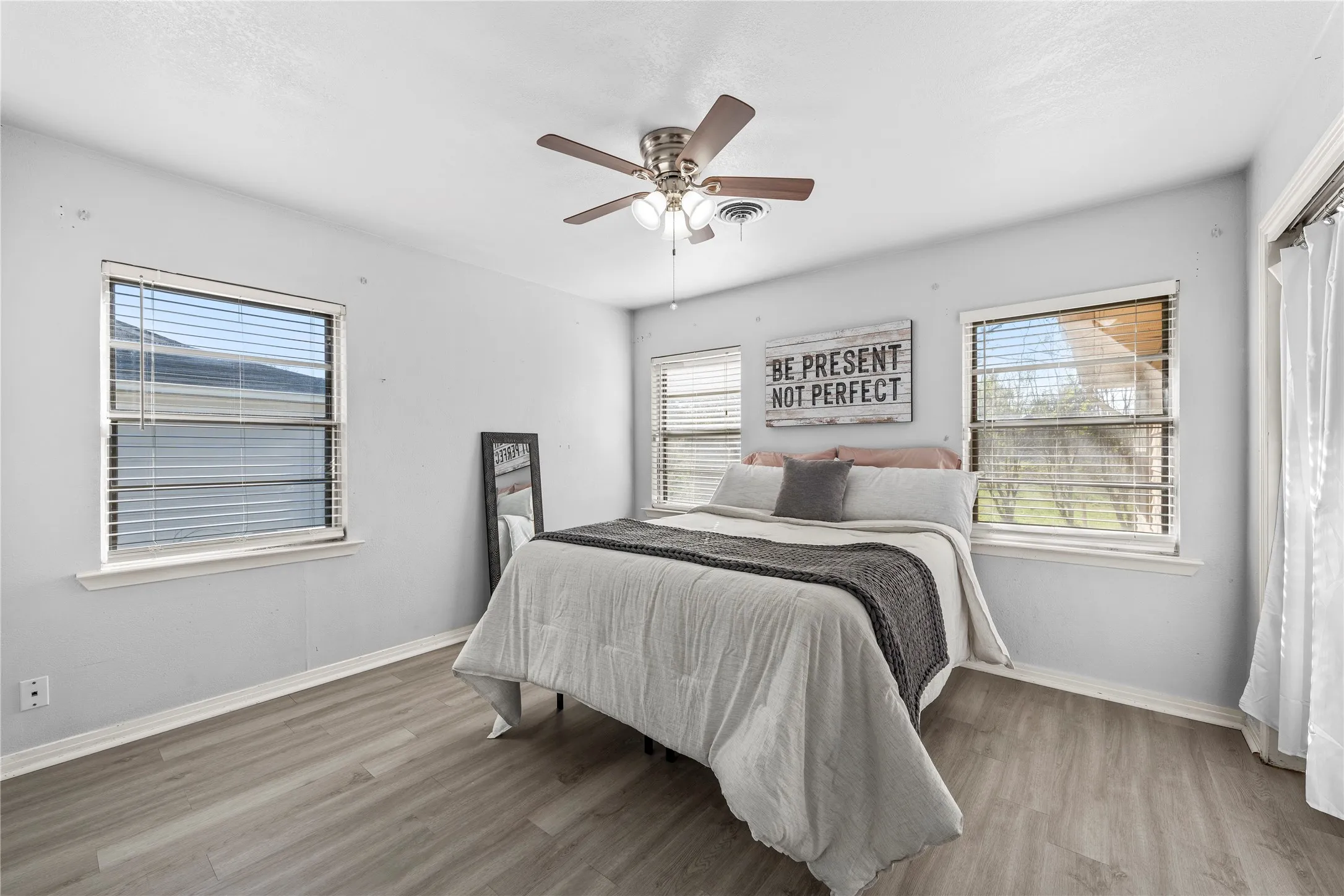 Bedroom featuring a ceiling fan and light wood-style floors