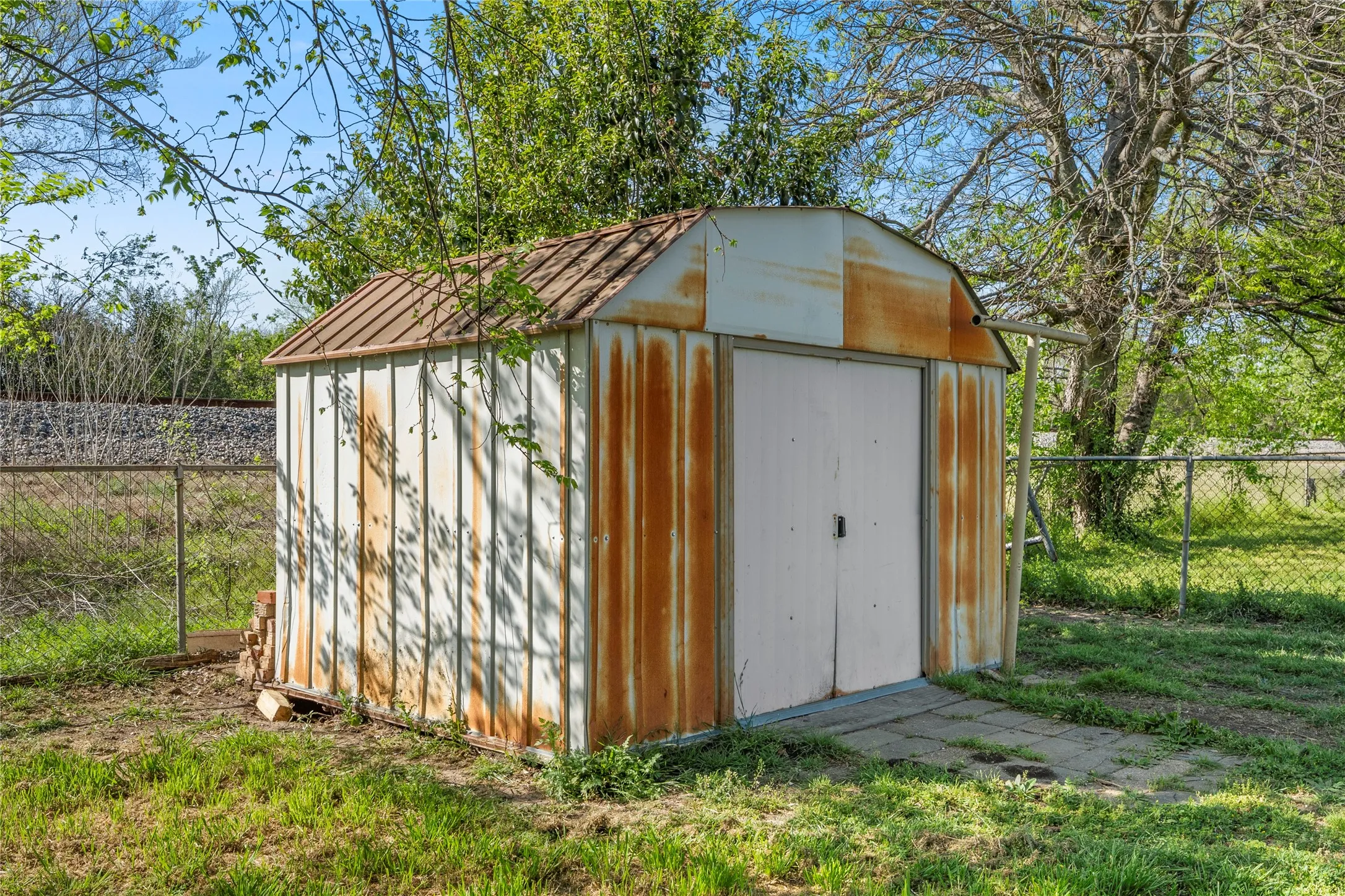 View of shed with a fenced backyard