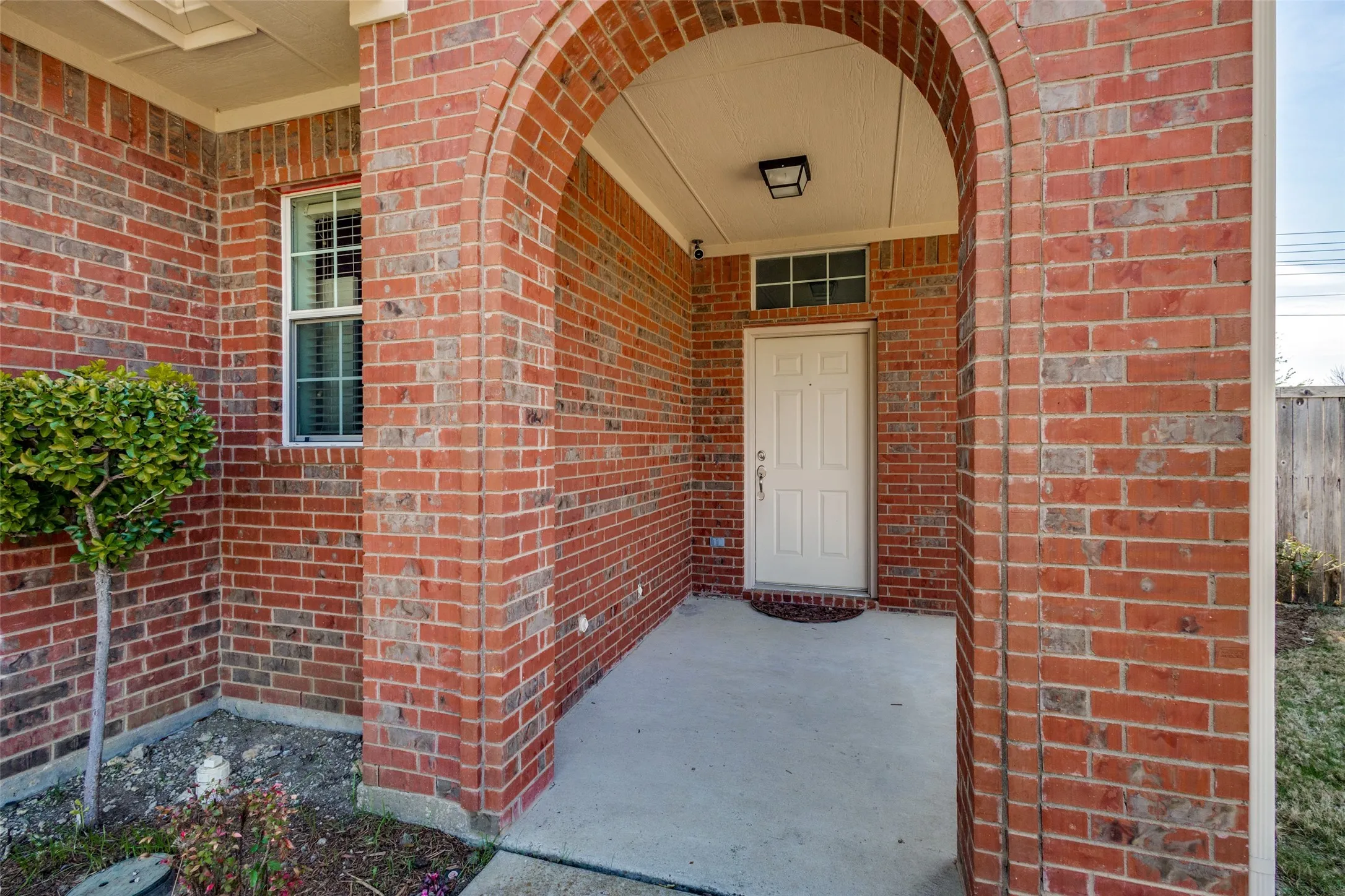 ARCHED ENTRY & COVERED FRONT PORCH~