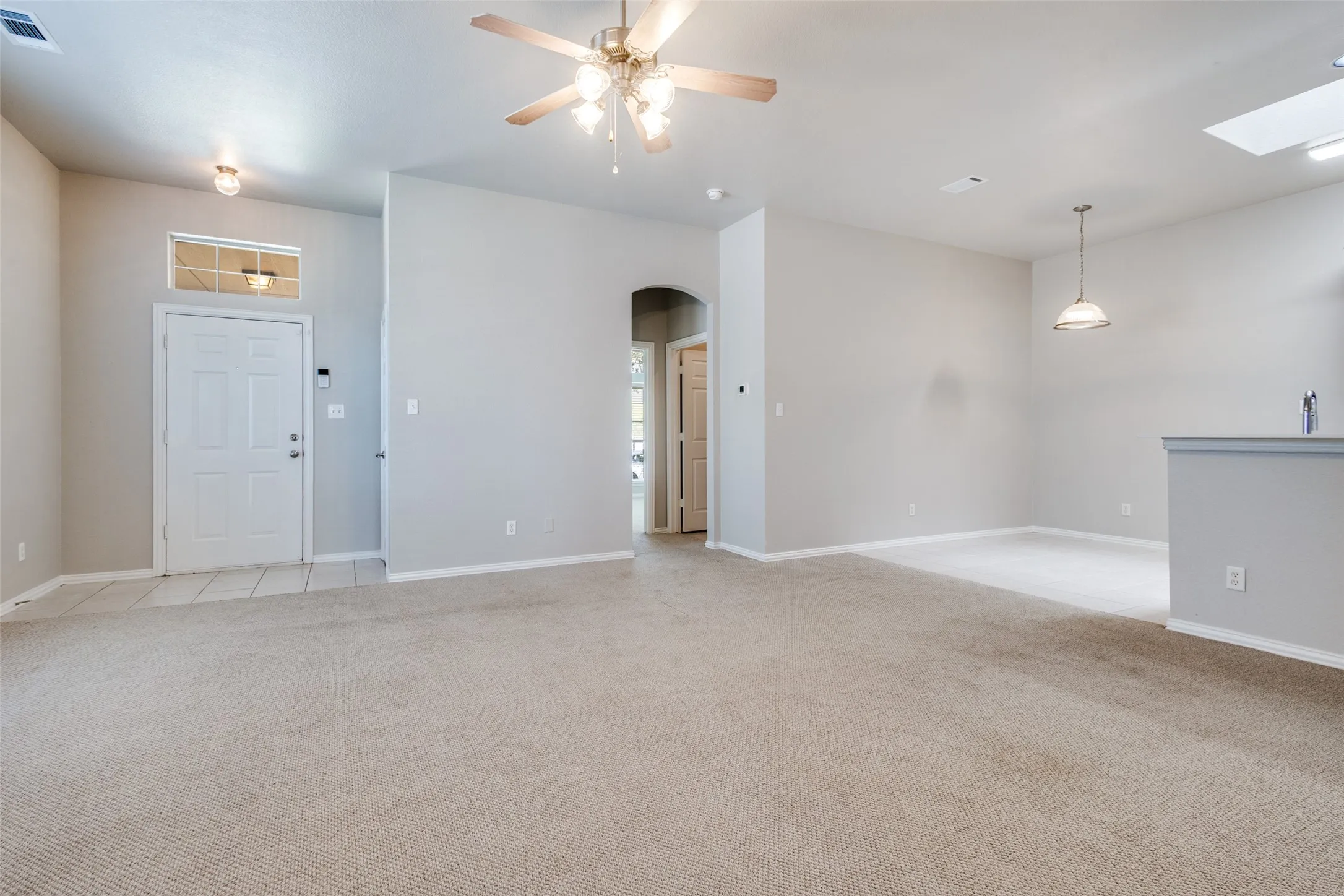 NATURAL LIGHT SPILLS INTO ENTRY & LIVING AREA~COAT CLOSET~