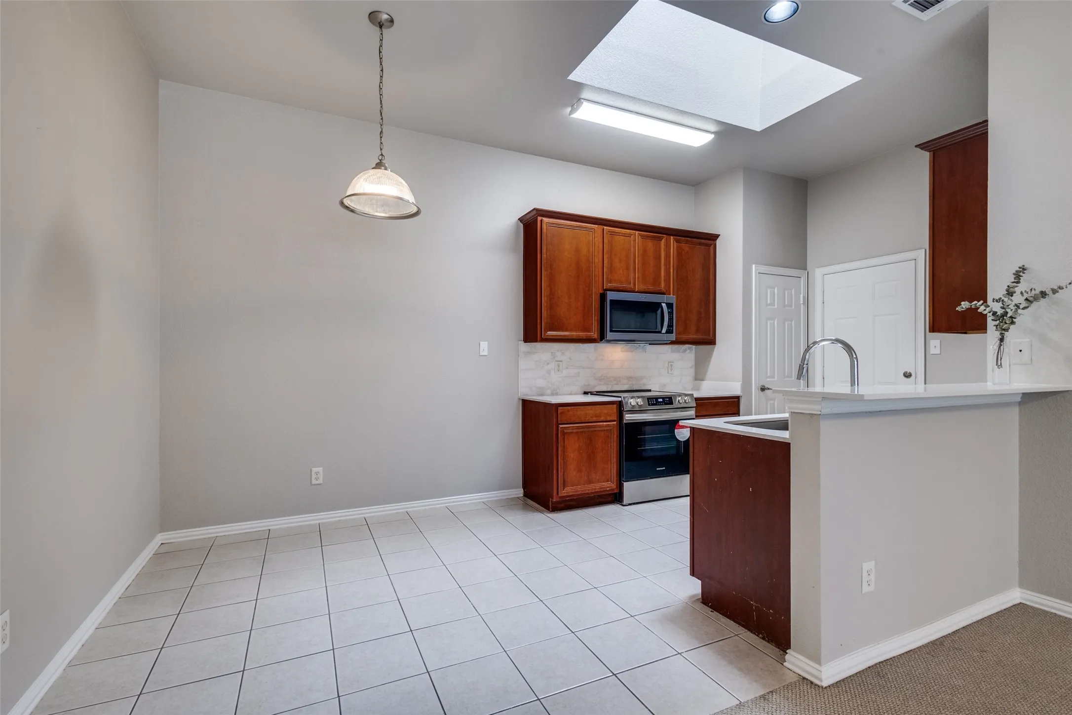 DINING AREA~UPDATED KITCHEN~GRANITE COUNTERTOPS & BACKSPLASH~