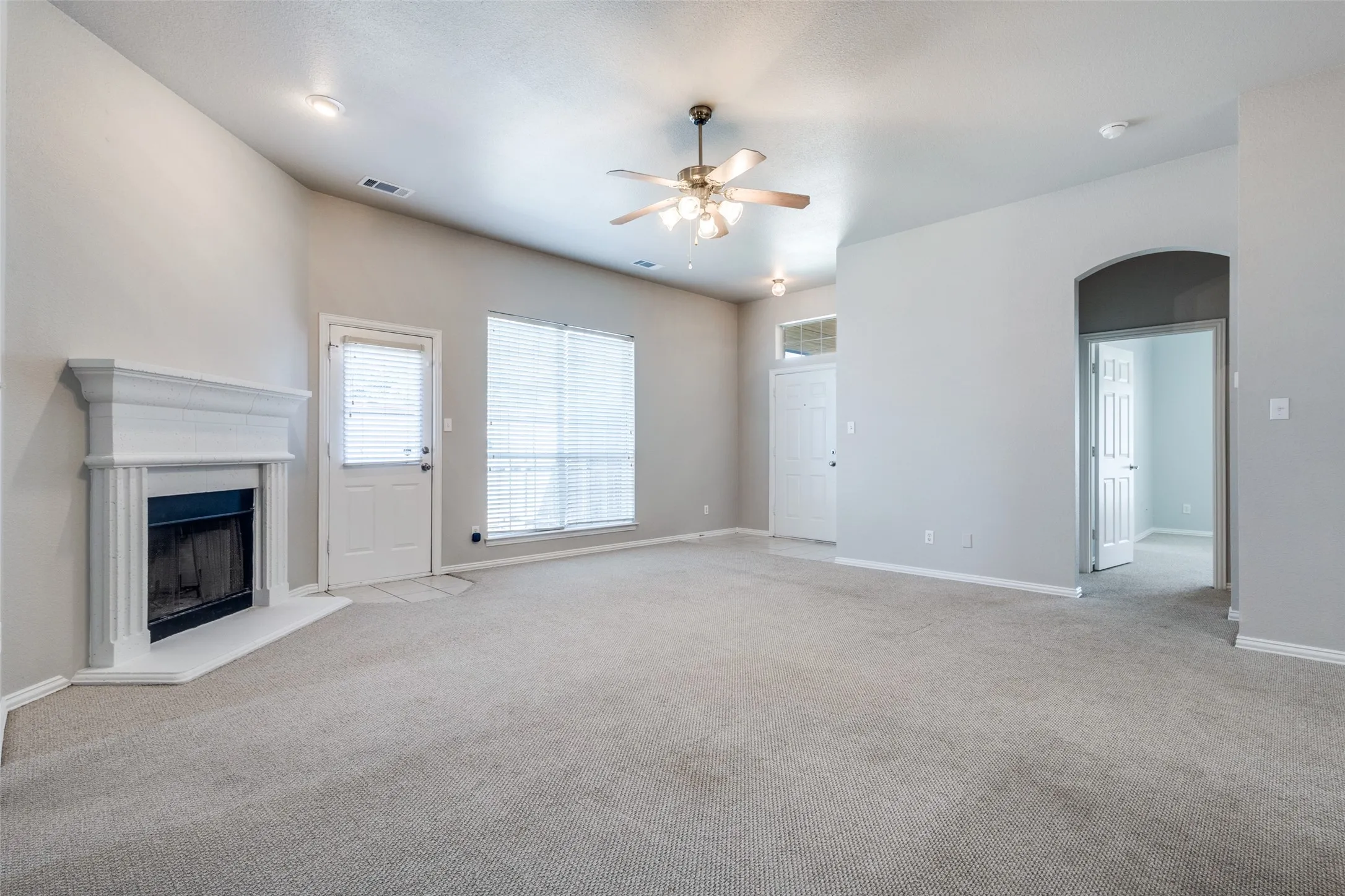 GRACIOUS SIZED LIVING SPACE WITH MASONRY WOOD BURNING FIREPLACE~