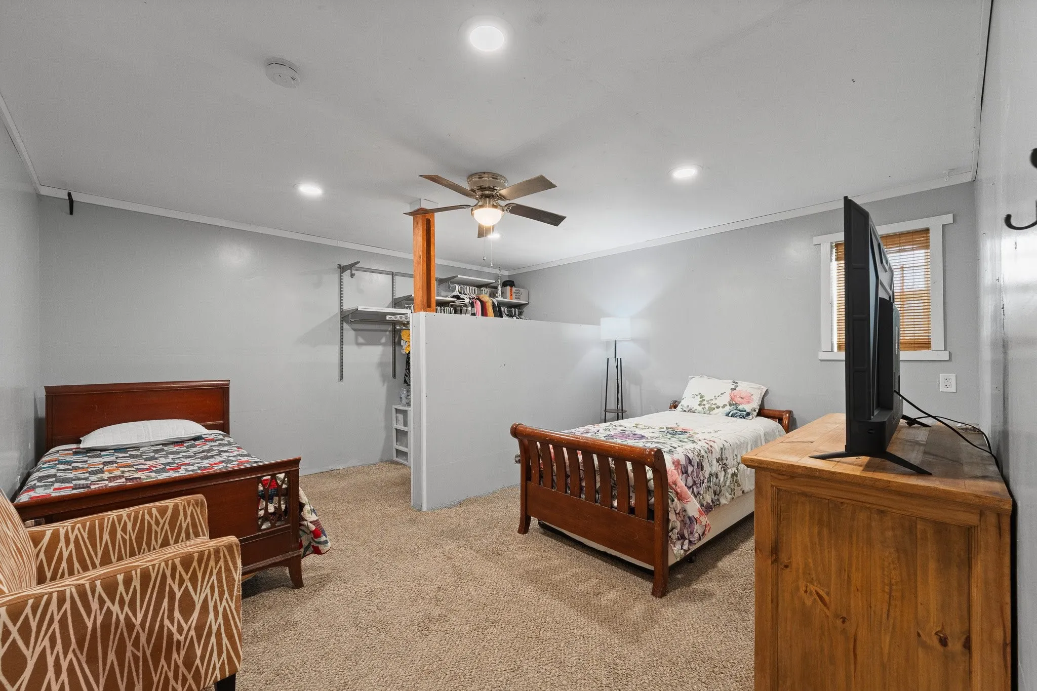 Bedroom 3 with light wood-style flooring, ceiling fan, and recessed lighting