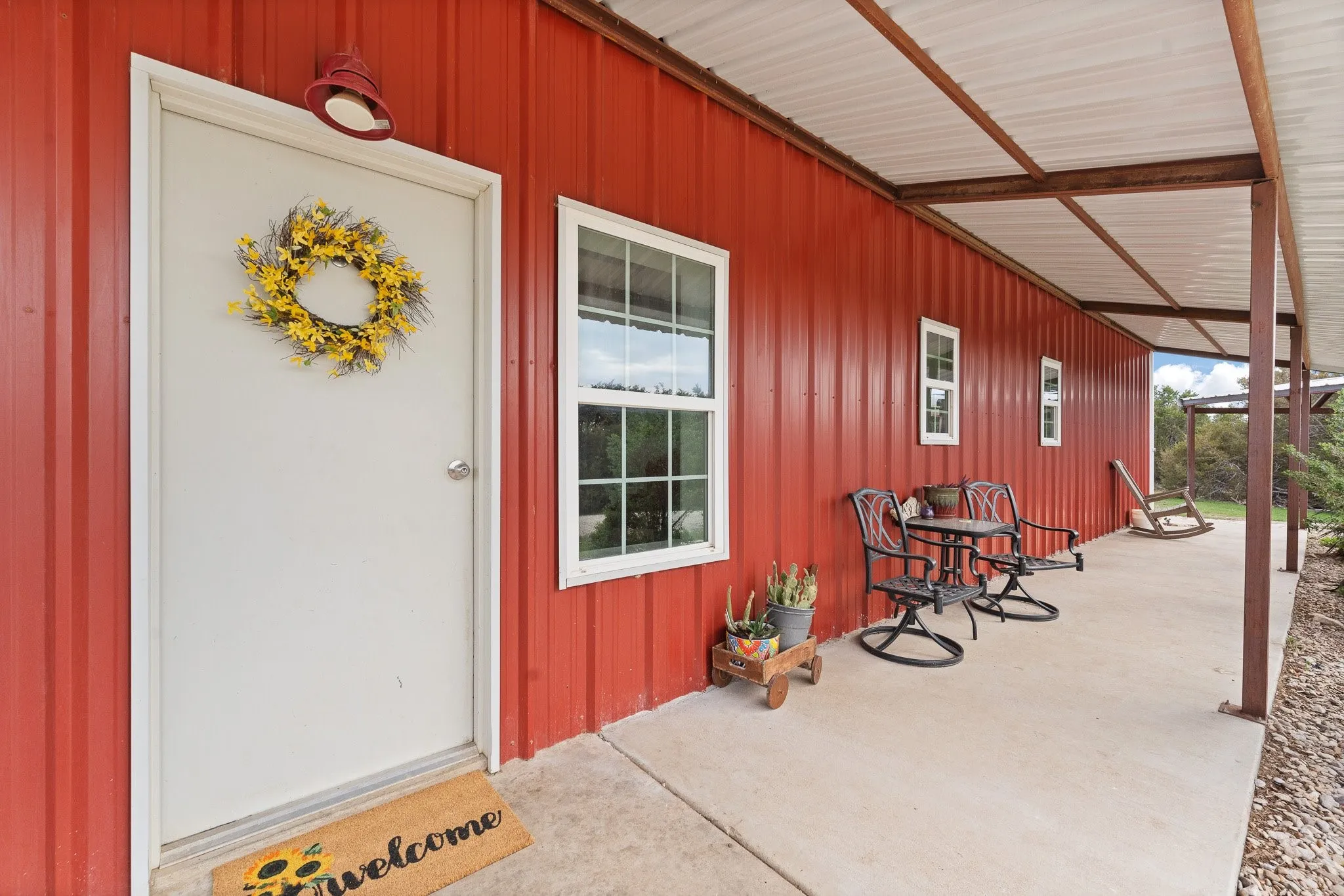 Doorway to property with covered porch