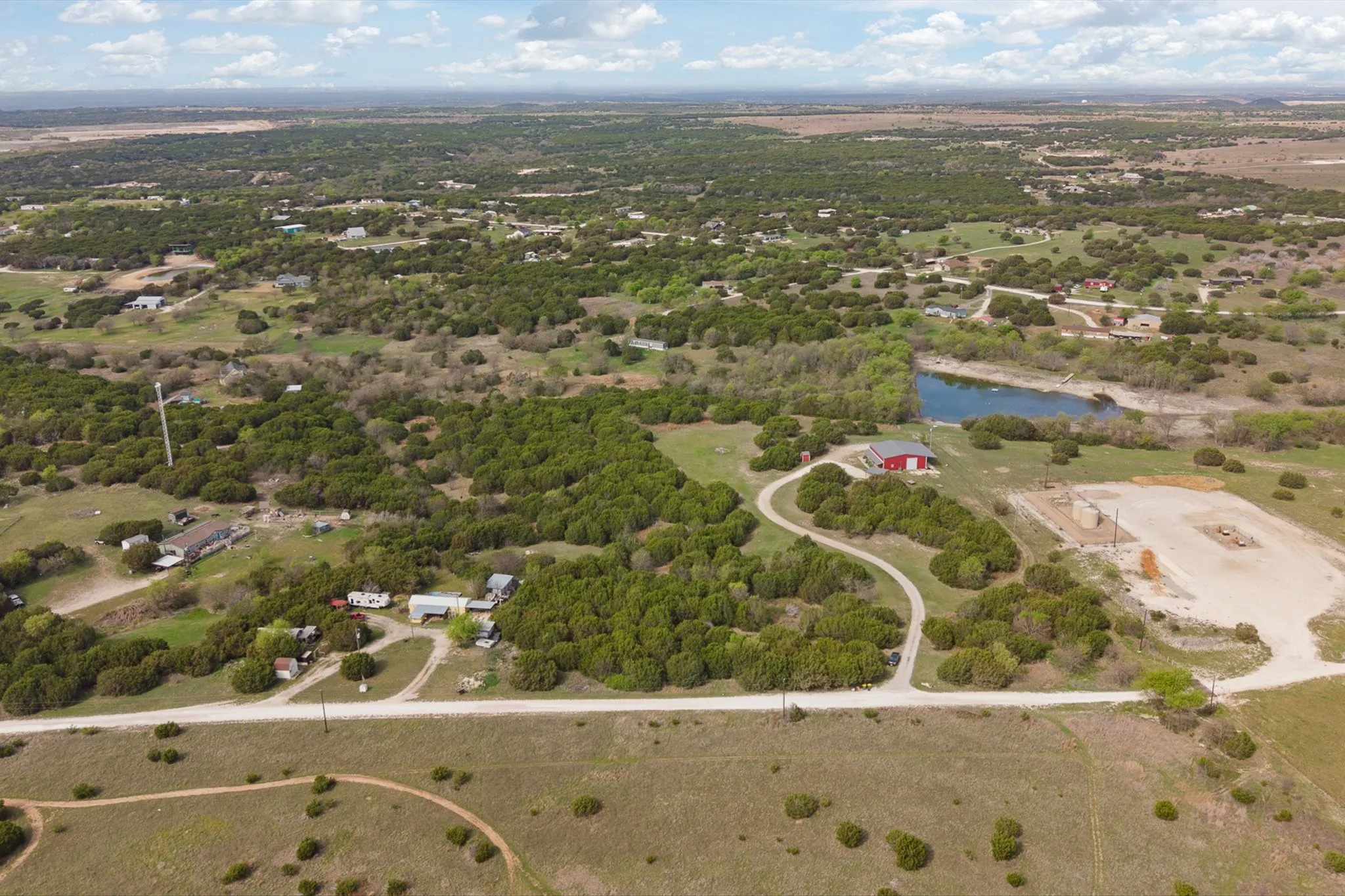 Aerial view of property's location with a nearby body of water
