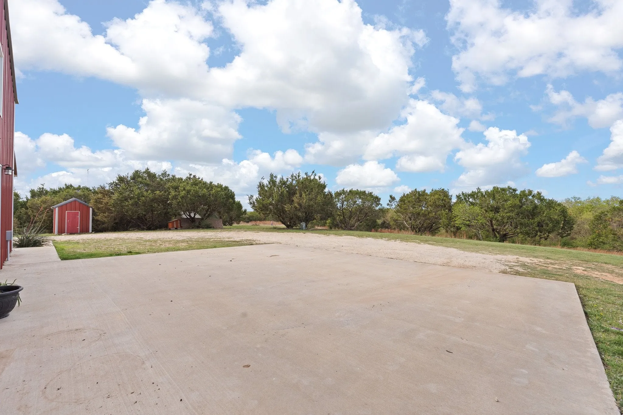 View of patio / terrace with a shed